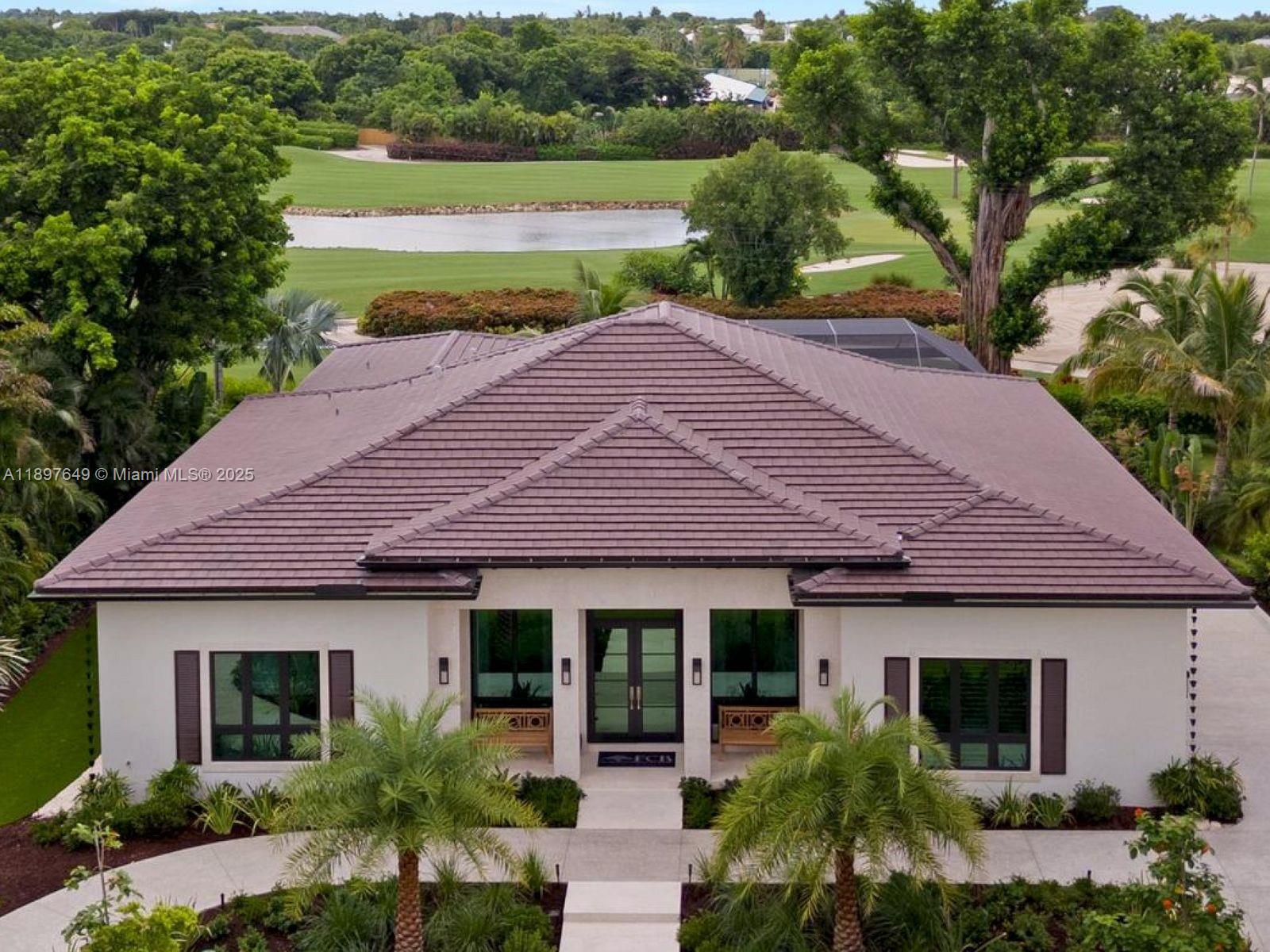Brand-new 4BD/5.5BA masterpiece on the 15th tee of the Dolphin Course at Ocean Reef Club®. Soaring ceilings, walls of glass, and designer finishes create seamless indoor-outdoor living with breathtaking golf views.
Chef’s kitchen with Wolf, Sub-Zero & Miele appliances opens to spacious living with a custom wet bar. Luxe primary suite offers coffee bar, spa bath & private sliders to the fairways.
Resort-style outdoor oasis features pool, spa, putting green & full summer kitchen—perfect for entertaining.
Enjoy world-class Ocean Reef amenities: marinas, golf, dining & more. Coastal elegance meets golf course living in Key Largo’s premier community.
