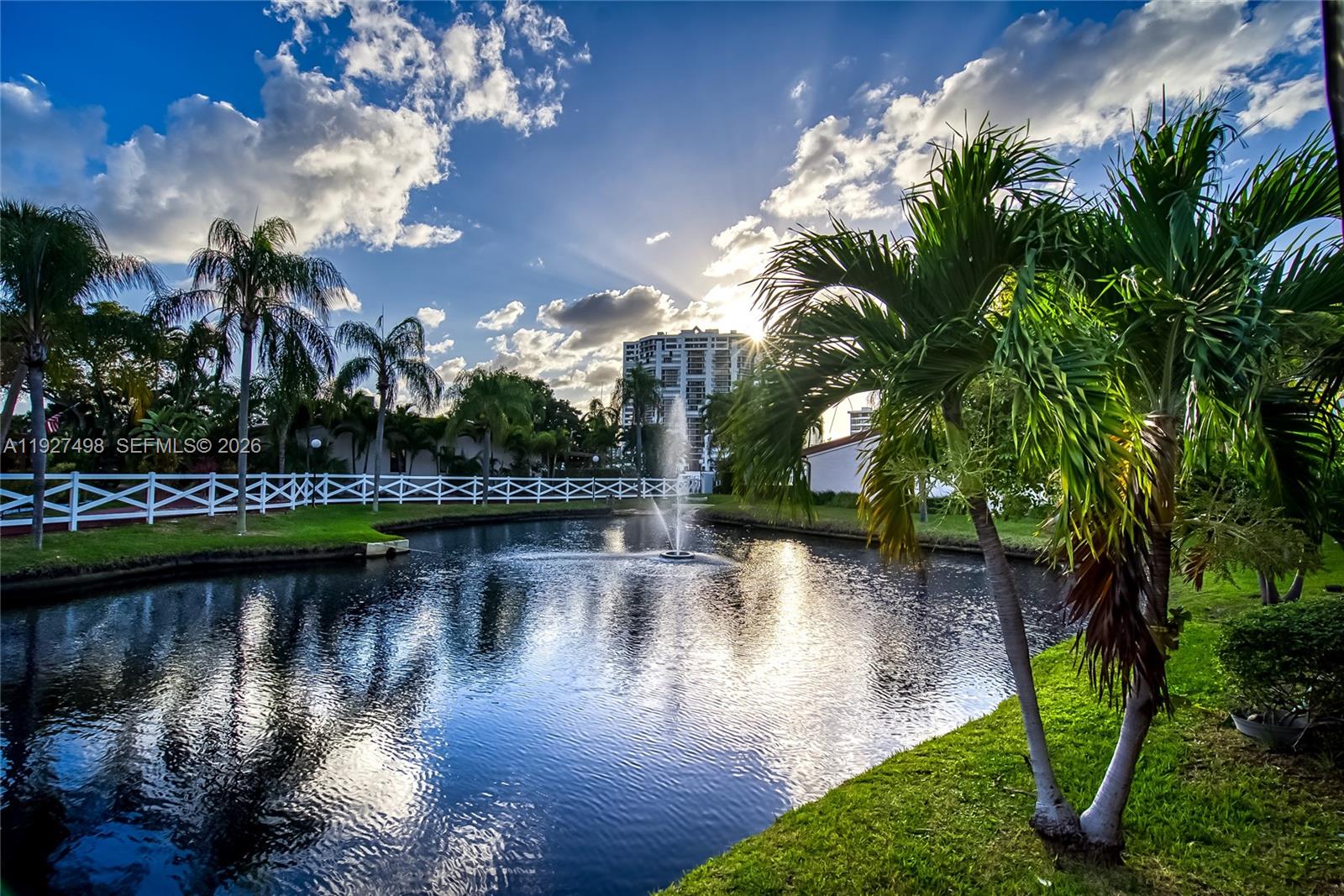Absolutely gorgeous 1 story townhouse on the water! Waterfront villa in Harbourwood Villas, Three Islands. Spacious and well-maintained 2 bedrooms /2 bathrooms with 1,680 SF of living area on a 2,125 SF lot. Family room may be converted to a potential third bedroom. Stunning Water view from the patio! tranquil pond views and partial marina views from this desirable corner Townhouse! Features include a remodeled kitchen with window, stainless steel appliances, new A/C, high vaulted wood-beam ceilings, impact windows and doors, tile flooring throughout, new water heater, 4 skylights, and 2 walk-in closets. Large paved and covered rear patio ideal for entertaining, plus a welcoming front porch. Two assigned parking spaces directly in front of the unit. Community amenities include pool, tennis courts, racquetball, sauna, and walking paths. Excellent location within walking distance to shops, restaurants, and the beach. Minutes to Gulfstream Park and close to two international airports.