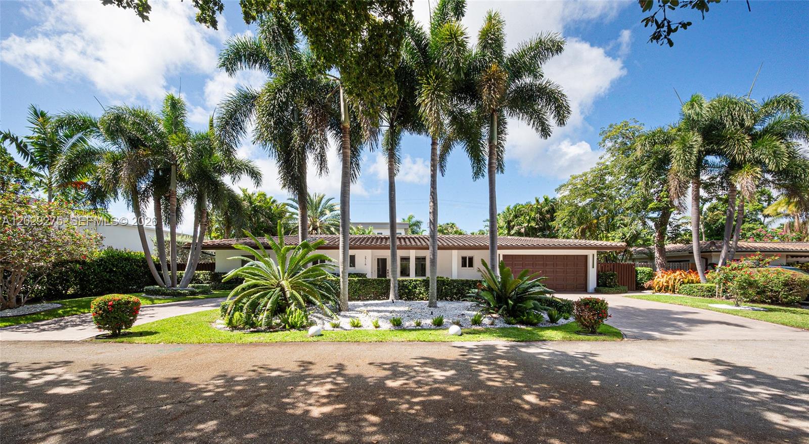 Luxury Coral Ridge home with irresistible charm. This meticulously updated 3BR/3BA residence sits on an expansive 10,000+ SF lot and combines timeless design with modern convenience in one of Fort Lauderdale’s most desirable neighborhoods. Highlights include impact windows and doors, soaring cedar plank ceilings, custom designer closets, motorized window treatments by ShadeTec throughout the residence, and abundant storage throughout. A climate-controlled double garage with a mini-split A/C and built-in cabinetry closets assures everything has its place. The private tropical backyard is an entertainer’s dream, featuring an impressive saltwater pool and spa, lush tropical landscaping, and integrated Sonos audio throughout the home. Located on one of the most coveted streets in Coral Ridge, zoned for top-rated Bayview Elementary and surrounded by luxury new construction and multimillion-dollar estates. Minutes to Fort Lauderdale Beach, Las Olas, shopping, dining, and boating. A rare opportunity in an exceptional location. Property is sold As is.