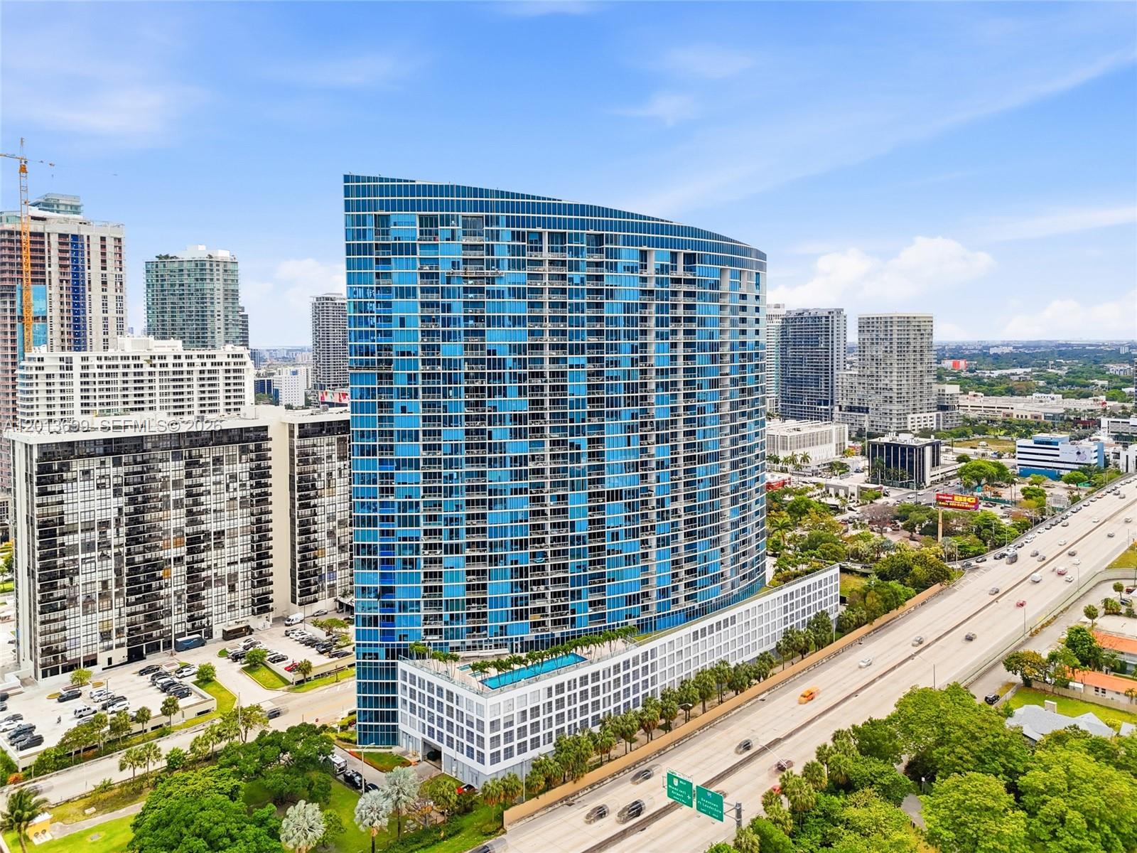 Experience 5-star resort living with breathtaking ocean views at Blue Condo. This spacious 2-bedroom, 2.5-bath residence offers stunning panoramic views from both the primary bedroom and living area, enhanced by floor-to-ceiling glass that fills the space with natural light. The unit includes two parking spaces (one assigned and one valet) as well as a private storage unit, and features a new AC system. The recently renovated lobby adds to the building’s appeal and long-term value.

Enjoy an impressive array of resort-style amenities, including two pools with sundeck, three hot tubs, a state-of-the-art fitness center, yoga and cycling studios, sauna, BBQ area, business center, movie theater, children’s playroom, game room, pet park, 24/7 security, valet service, and a 24-hour convenience store.

Blue Condo allows short-term rentals (minimum 90 days, up to 4 times per year), making it an excellent option for part-time owners seeking both personal use and seasonal rental income. Ideally located near Midtown, the Design District, Wynwood, Miami Beach, and Miami International Airport, this property offers the perfect balance of lifestyle and investment opportunity.