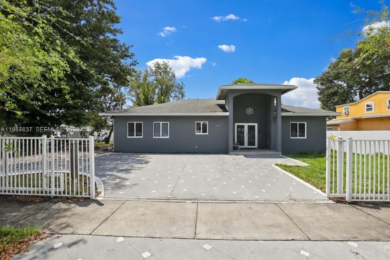 Welcome to this modern 2018-built home offering space, style, and flexibility in the heart of Miami. Situated on a spacious 7,500 sq ft lot, this property features 4 bedrooms and 3 bathrooms, plus 2 additional flex rooms currently being used as bedrooms—perfect for large families or income-producing potential.

Step inside to an open and airy layout highlighted by high ceilings and a grand entryway with chandelier, creating a bright and inviting atmosphere. The home features porcelain tile flooring throughout, a modern kitchen with quartz countertops and stainless steel appliances, and well-designed living spaces ideal for both everyday living and entertaining.

The primary suite offers generous space and a walk-in closet, while the overall layout allows for multi-generational living or room-by-room rental opportunities.

Enjoy added value with impact windows and doors, a private driveway, and no HOA restrictions. The oversized lot provides ample space for outdoor living, with room to add a pool, park multiple vehicles, or store a boat.

Ideal for investors, large families, or buyers seeking a newer construction home with strong income potential.