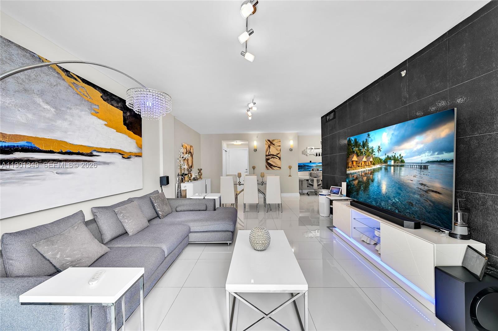 All offers welcome! Seller motivated. Fully renovated and furnished oceanfront residence offering breathtaking views from every room. Elegant glass tile floors, a sleek modern kitchen with premium finishes, and beautifully renovated bathrooms. Custom lighting throughout. Enjoy resort-style amenities including fitness center, heated oceanfront pool, cabanas, BBQ area, clubroom, tropical waterfall jacuzzi, and business center. Prime Hollywood Beach location, minutes to dining, shopping, and the Broadwalk.