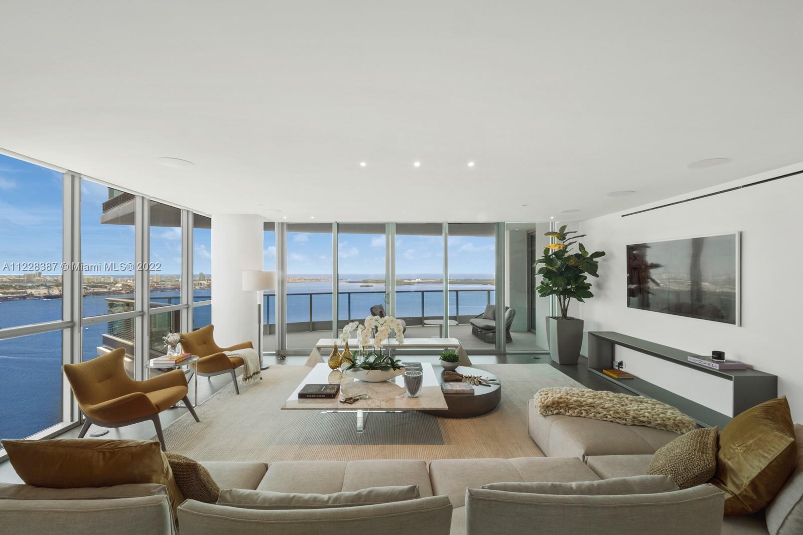 A modern Max Strang masterpiece in the skies of Jade Brickell. This stylish residence has been creatively redesigned to a 3 bedroom + study in the finest taste. 3,400+ SF and 3 balconies allow luxury and expansive bay views to be experienced at every turn. The beautiful dining lounge and chef's kitchen is outfitted in the same custom Italian millwork found throughout the residence and ErnestoMeda cabinetry with WOLF + Subzero appliances. The Primary Suite is a welcome reprieve from the hustle and bustle of the city with direct water views and an ensuite bath to rival the finest spas with a soaking tub and separate steam shower. Fully automated smart-home provides security, entertainment, and ease at the touch of a fingertip, making this cutting-edge sanctuary is a true cut above the rest.