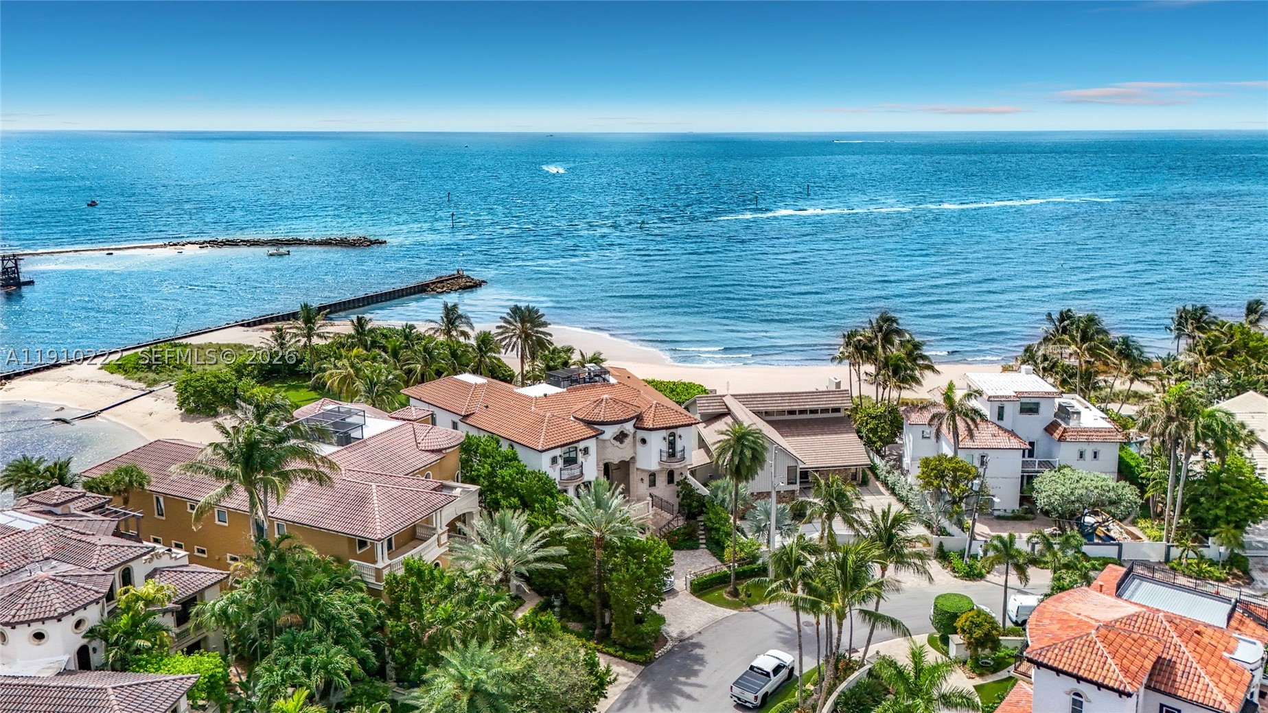 EXCEPTIONAL NEW PRICE-EXCEPTIONAL VALUE. 3414 Norfolk Street stands out as one of the most compelling residences in Hillsboro Shores. Beautifully updated and move-in ready, it is just steps from your private gated beach entrance. Discover a friendly, intimate, eclectic seaside community where charming coastal homes and multimillion-dollar residences share the same coveted lifestyle and golf cart-friendly streets. The Hillsboro Lighthouse and Inlet, waterfront dining, marinas, parks, and fishing are all nearby. Designed for year-round living and entertaining, this distinctive 4-bedroom, 3-bath home blends architectural character with $600,000 in extensive modern updates. Its European copper turret, curved dining room, travertine floors, limestone fireplace wall, and floating staircase create a style all its own. The chef’s kitchen features high-gloss cabinetry, Bosch and Dacor appliances, and crystal marble countertops. The first-floor primary ensuite offers a spa-inspired bath and custom closets. Outdoors, enjoy a private backyard oasis with a saltwater pool and waterfall, spacious veranda with summer kitchen. Mature landscaping provides excellent separation from neighboring properties. Impact windows and doors, a warrantied tile roof, newer A/C, natural gas, custom built-ins, and a completed inspection enhance this turn-key home.  Blueprints are available to extend upstairs.  Ideal as a primary or legacy home, seasonal retreat or luxury rental investment. Full brochure.