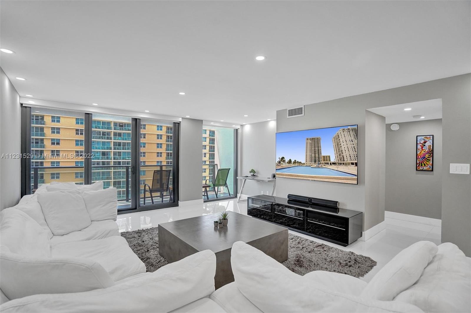 Love this updated zen-modern 2 bed/2 bath oceanfront condo w/breathtaking ocean & city views. Renovations incl impact windows/doors, glass balcony railing, large 32" x 32” tile floors & recessed LED Lutron lighting. Enjoy cooking/entertaining in the open kitchen with granite countertops/backsplash & KitchenAid appliances. Bathrooms feature tall, dual vanities & glass tops. Closets include built-in shelving. New-modern lobby entrance by award-winning Steven G Interiors. World Class amenities: 2 heated pools, fitness center, sauna, billiard rm, business ctr, yoga/water aerobics classes, umbrella/beach chair service, on-site restaurant, valet, 24/hr security. Near Hollywood Broad walk and FLL. Tenant occ. 24-hr notice, $250 CLEANING FEE.