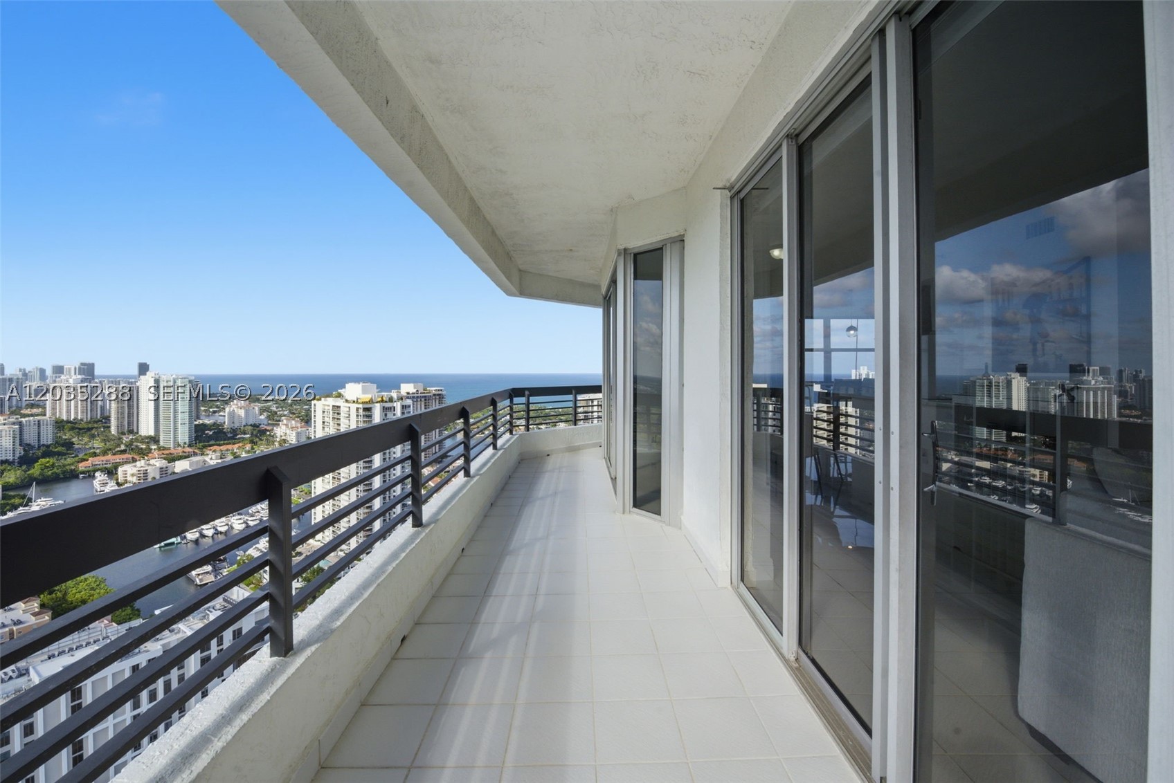 Perched high above Aventura, this fully updated penthouse stuns with floor-to-ceiling windows that bathe every room in natural light, panoramic views of the Atlantic Ocean, Intracoastal Waterway & Turnberry Golf Course, and city skyline can be enjoyed on your sprawling private wrap-around terrac. Your personal front-row seat to South Florida's finest scenery. Start your mornings with coffee as the Atlantic glows at sunrise, entertain effortlessly in the fully renovated open-concept kitchen complete with top of the lineappliances, then retreat to your spa-inspired ensuite featuring a soaking tub, double sinks & gorgeous walk-in closet. Guest bedroom fully updated as well. In-unit washer/dryer and tile floors throughout. This resudence is Fully furnished & move-in ready, just bring your toothbrush! The gated Mystic Pointe community delivers true resort-style living: world-class marina, clay tennis courts, heated pool, fitness center, basketball court, sauna, 24-hr concierge, plus an on-site restaurant, hair salon & more. Just 5 minutes to Aventura Mall, the beach & grocery stores. 6-month minimum rental. Prices vary by season, iinquire for pricing.