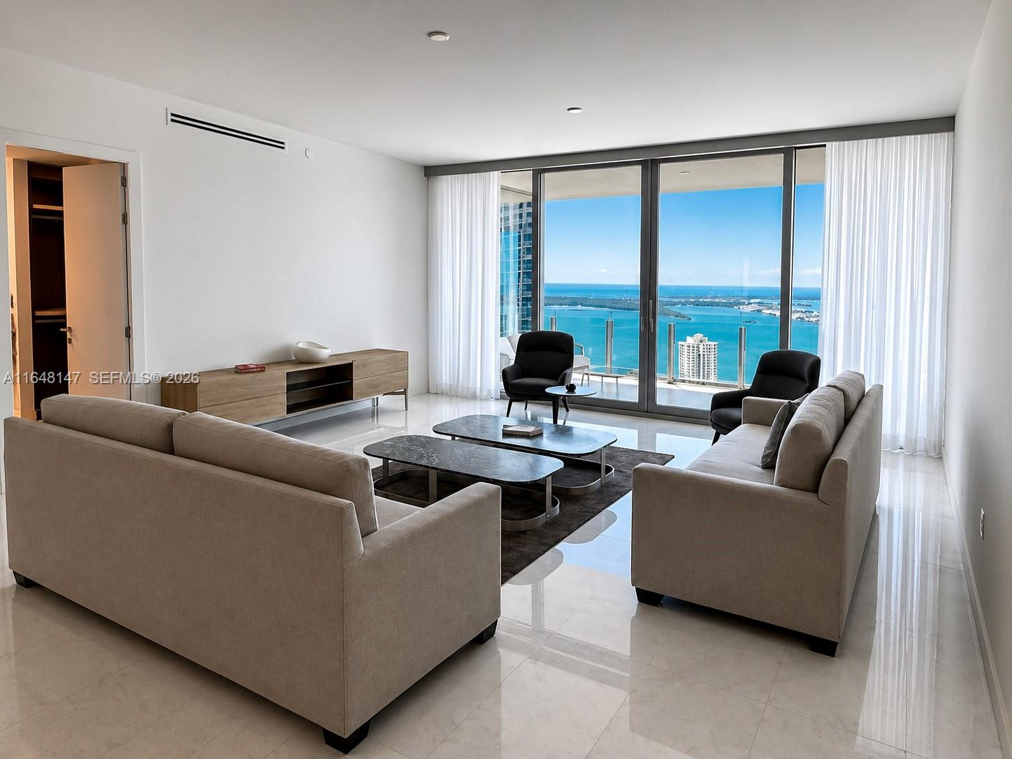 Aston Martin Residences Miami is a luxury residential tower located at 300 Biscayne Boulevard Way. Developed by G and G Business Developments, this 65-story skyscraper features 391 high-end condominiums with designs inspired by the iconic Aston Martin brand. Residences offer expansive layouts, floor-to-ceiling windows, and top-tier finishes. Amenities include a private marina, a state-of-the-art 2 floor wellness center, a sky deck with a pool, and more. The building’s sleek, modern design and prime waterfront location make it a prestigious address in Miami’s vibrant downtown area.
