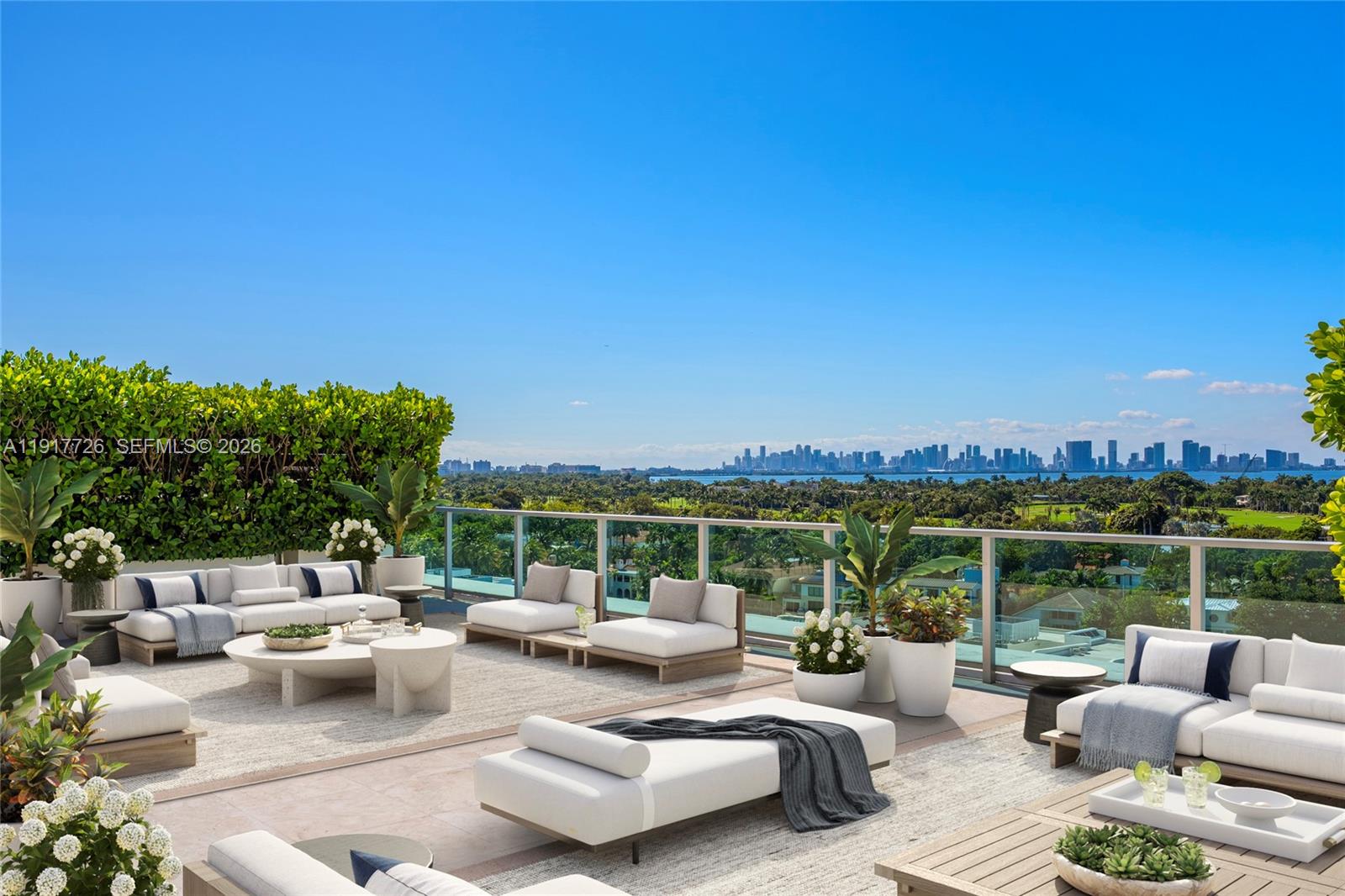 Sun-drenched lower penthouse showcasing grand proportions, 13’ ceilings, and an additional 2,466 SF of sprawling private terraces. Tranquil retreat and a rare offering in the heart of the city. A true sanctuary in the sky, redefining scale and sophistication with sweeping views of Biscayne Bay, ocean, and the iconic Miami skyline. 
Upon entering, a grand 1,000 SF glass-wrapped great room unfolds. Tall glass doors slide open to landscaped terraces/ private gardens perfect for al fresco dining and entertaining. With soaring ceilings, each bedroom suite is framed by walls of glass and bathed in natural light. Boundaries between indoors, outdoors, and the city skyline beyond are dissolved. Elegant powder room and large laundry room complete the thoughtful design of the residence.