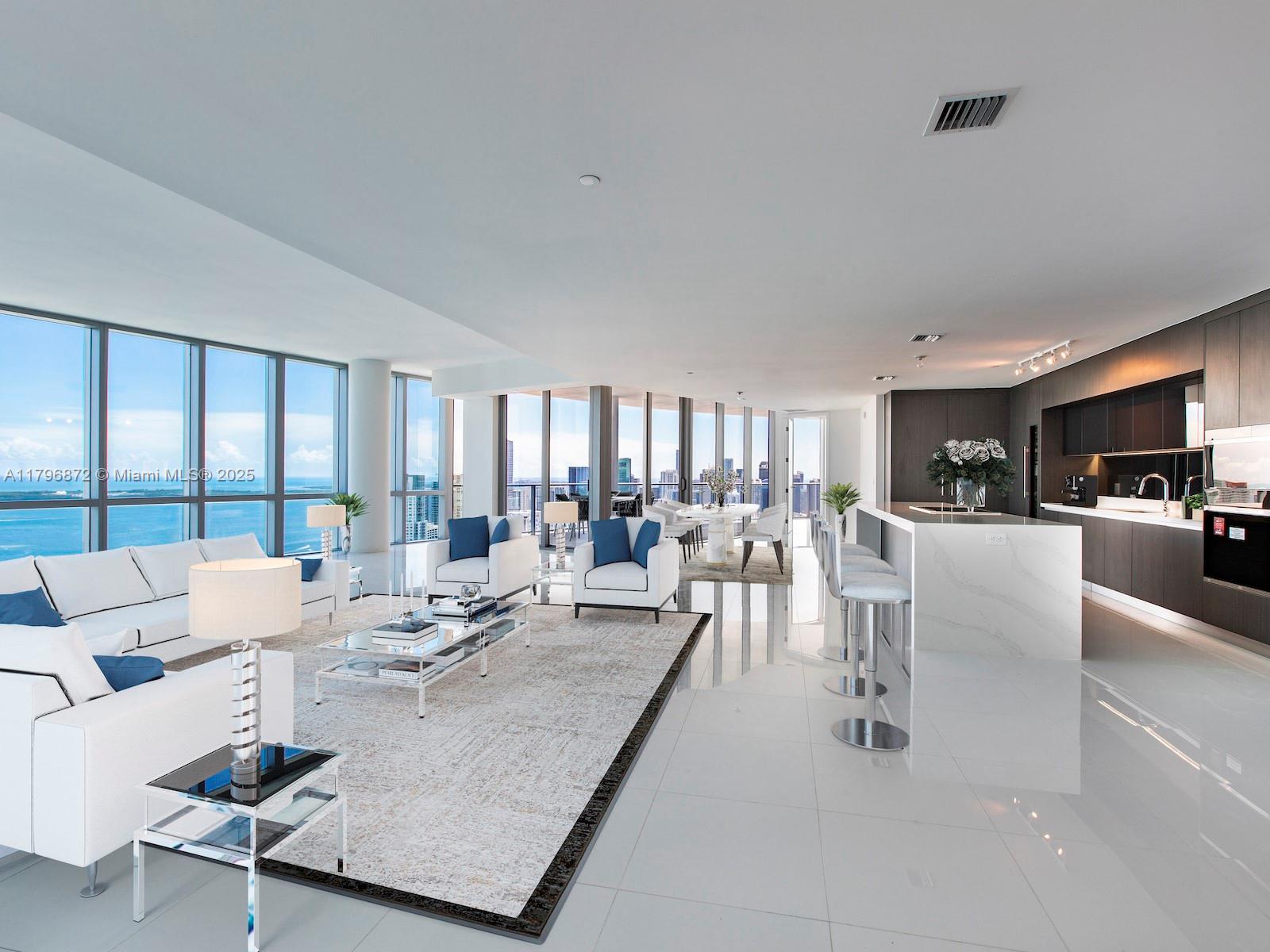 Spectacular 4 bedroom, 5 bathroom penthouse unit with an additional den in Miami’s iconic Paramount Miami Worldcenter. This new-construction unit on the 50th floor offers incredible views from every room across its over 4K SqFt. Residents enter the unit via its private elevator and step into the great room, featuring floor to ceiling windows, a European-style kitchen & a 530 SqFt balcony, perfect for entertaining. This penthouse unit offers a split floorplan with a large master-suite, 3 large guest bedrooms with in-suite bathrooms and walk-in closets, and a separate den with a full bathroom and large closet. Paramount Miami Worldcenter offers resort-style amenities and is located in the heart of Downtown Miami, steps from the city’s most popular attractions and the shores of Biscayne Bay.