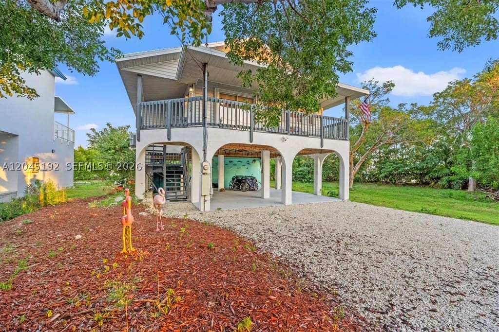 Beautifully Renovated Single-Family Home in the Florida Keys This stunning 2-bedroom, 2-bathroom home with extra guess room downstairs, fully renovated in 2024, is perfect for fishing enthusiasts and those seeking a serene island lifestyle. The property boasts a 50-foot dock with no bridges to the ocean, ideal for quick access to the water. Located in a quiet neighborhood, this home features a 2018 roof and a brand-new AC installed in 2024. Rentals are permitted, making it a great investment opportunity. For a full-price offer, the home comes fully furnished, including all pool tables. Don't miss out on this dream home in the Keys! SELLER MOTIVATED!!Show: 24 Hour Notice; Alarm System; Call List Agent