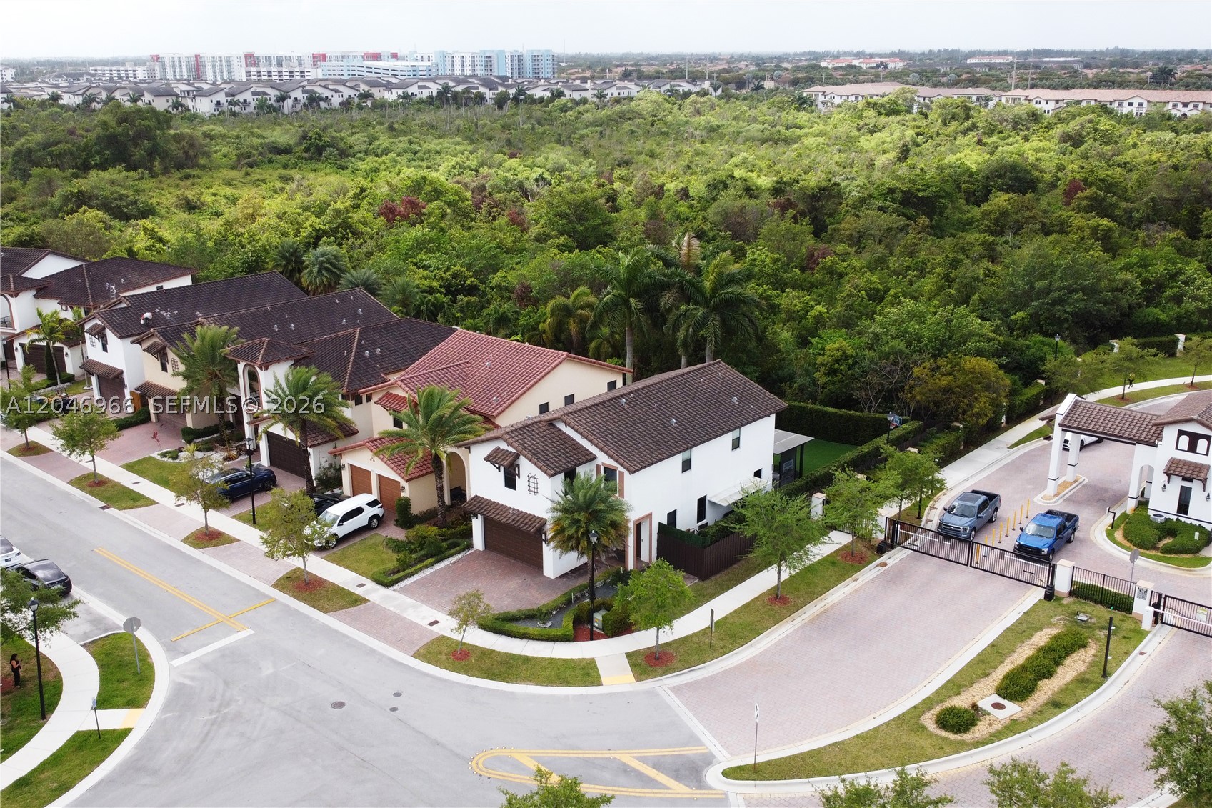 Welcome to your dream home in the exclusive Madison Pointe/Doral community (just 64 homes). This EXQUISITE UNIQUE two-story residence boasts 5 spacious bedrooms and 4.5 elegant baths (including a large bedroom and bath on the first floor), FULLY UPDATED, perfectly crafted for comfort and style. Situated on a private corner lot, enjoy no neighbors to the right or behind. Step onto a stunning covered terrace and deck, featuring a fully equipped DCS summer kitchen, outdoor Bose sound system, TV-screen and enchanting night lighting, perfect for entertaining. The leveled back terrace has artificial grass and ample space for a pool. Enjoy the breathtaking glass staircase, peace of mind with fully impact windows, a modern kitchen, built-in closets, and MUCH MORE......MOVE-IN READY.......Call L.A. for appointment.