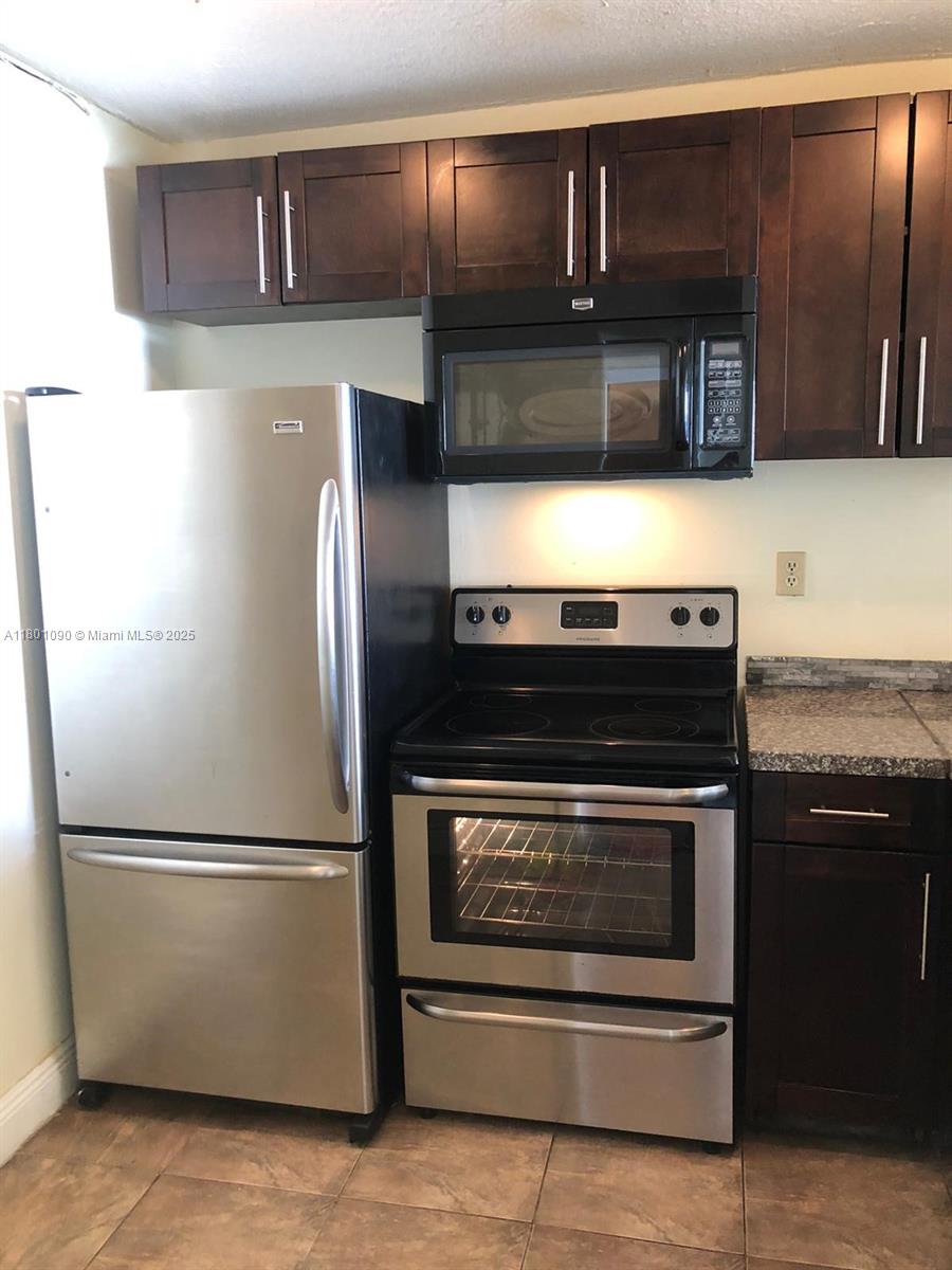 Spacious 1/1 unit on the 5th floor. Tile floors throughout. Kitchen features stainless steel appliances and granite counter tops. Convenient location close to main highways. Big balcony with pool views. Pets allowed. Management on-site, laundry room on every floor, community pool, tennis court, exercise room. Guard at gate, gated complex. 1 assigned parking space. Additional spaces can be rented from association. Rented $1550 until February 19, 2027.
