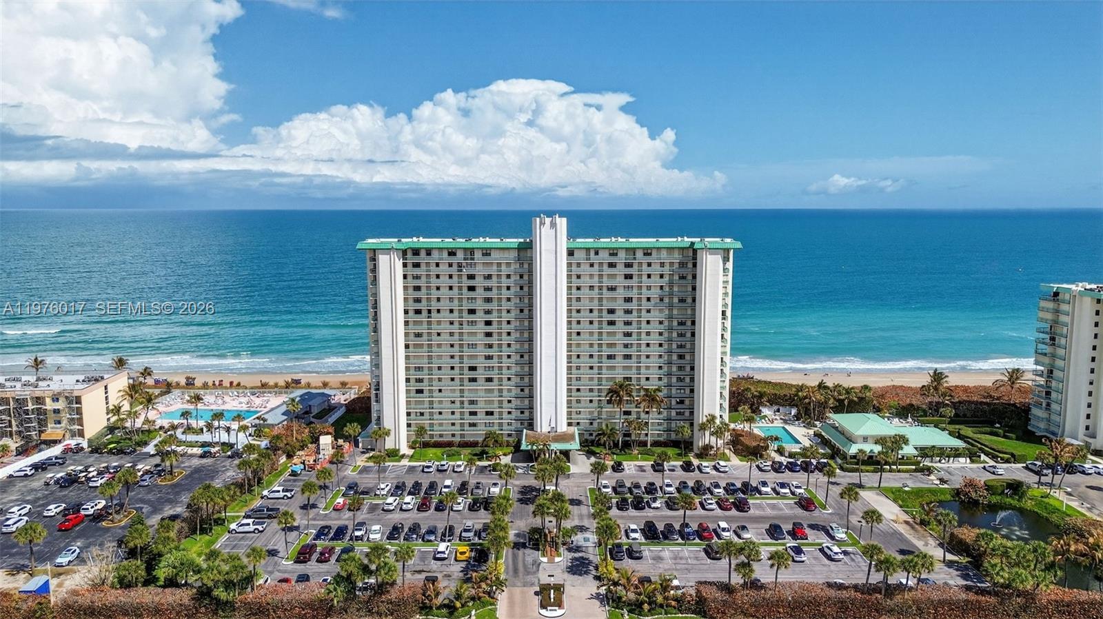 IMPACT DOORS AND TURTLE SAFE GLASS.Experience coastal living at its finest in this 11th-floor oceanfront condo at 9900 S Ocean Drive. This spacious 2-bedroom, 2-bath residence offers 1,141 square feet of well-designed living space with breathtaking, unobstructed ocean views and in-unit laundry. Wake up to stunning sunrises and enjoy the sound of the waves from your private vantage point. This oceanfront residence delivers location, views, and true coastal living.