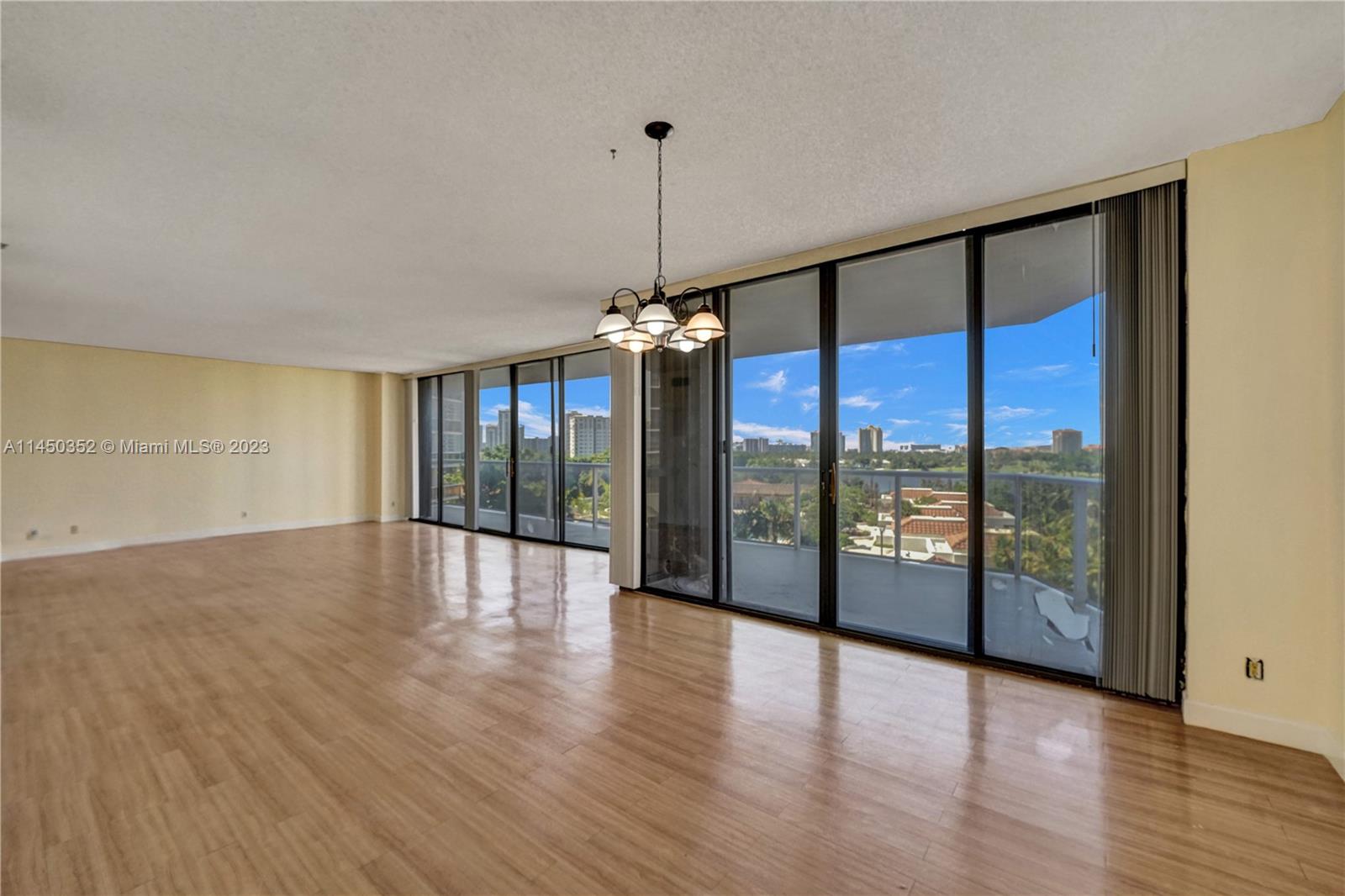 Don't miss the best deal of this model in The Hamptons! Enjoy beautiful views of the golf course, lake & pool, from both the inside & the outdoor space. Oversize balcony that hugs the main living areas including the master bedroom. Largest 2BR/2BA. Partial Ocean, Intracoastal & Waterways views can be seen from the kitchen, 2nd BR & balcony. Bright corner unit, 1,800 sq. ft. of living area & wood floors. Upgraded kitchen: quartz countertops, white wood cabinets, tiled backsplash, SS appliances & a breakfast nook. Both baths w/new vanities. Ample closet space. Luxury living: 2 pools, private gourmet restaurant & movie theatre, fitness center/spa, tennis, racquetball, coffee shop, party rooms & kids’ room. 2018 Special assessment was paid in full by Seller. Seller financing available.