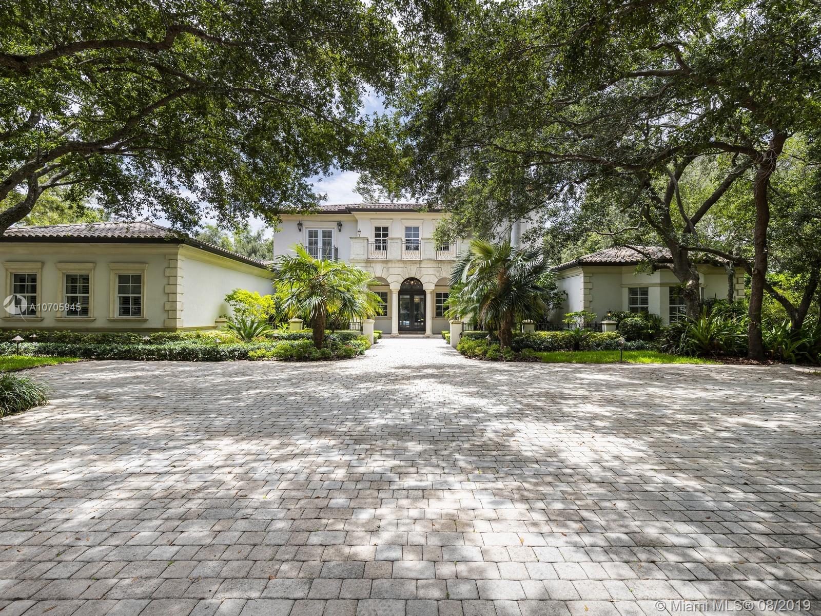 Fill your desire of residing in the ultimate retreat. Located in sought after North Pinecrest, this custom-built estate is a synthesis of sophistication and contemporary aesthetics sitting on a 1.15 acre-lot. Welcomed by expansive gate entry surrounded by mature oak trees and illuminated landscaping, find pleasure in exploring the property’s ample exterior entertaining space with modern home integration, resort style pool, and summer kit. Grounding the home is a spacious master bedrm and bath with surplus bedrms on second flr. An inviting residence, the bright design is fixed with high ceilings, formal living, dining rm, library, den, and family room adjacent to gourmet kit. Additional features include wine cellar and 3 car garage.