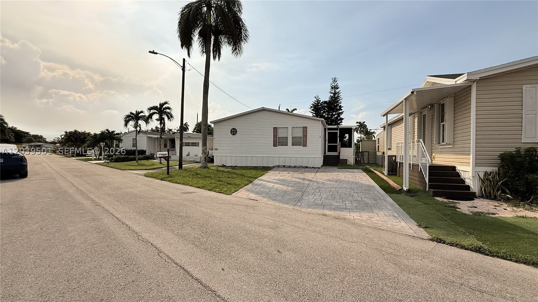Rare find—one of the few 3-bedroom homes in the community. Ideally located just 2 minutes from I-595 for an effortless commute across South Florida. Unlike most mobile homes, this one sells WITH THE LAND INCLUDED: you own the lot outright—no lot rent, no membership, no land lease, nothing extra to buy. It's like buying a house. The foundations were recently rebuilt and carry a 25-year warranty that transfers to the new owner. The roof was just fully restored and sealed, and brand-new access stairs were installed (warranty included). Exceptionally well maintained throughout—this home truly doesn't feel like a mobile home, it feels like a house. Turnkey, worry-free living in an unbeatable location.