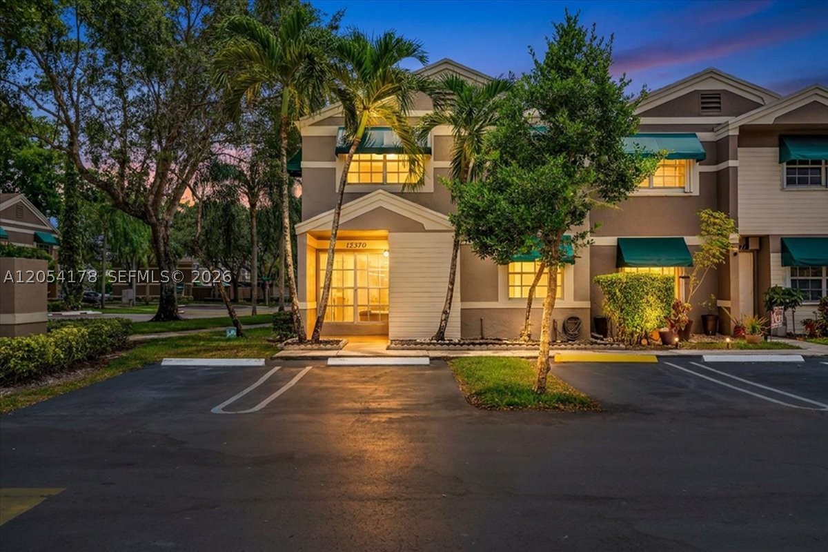 Welcome to this beautifully updated townhouse in Flamingo Lakes Townhomes community, where every detail has been refreshed for modern living. The entire interior has been remodeled with brand-new flooring, stunning new bathrooms, fresh interior paint, smooth ceilings with no popcorn, and stylish finishes throughout. This bright and spacious home offers 3 bedrooms, 2.5 bathrooms, and an inviting layout designed for both comfort and functionality. The kitchen seamlessly connects with the living and dining areas, creating a comfortable space for everyday living and entertaining. Large windows throughout flood the home with natural light, creating a warm and welcoming atmosphere. Upstairs, you'll find two generously sized bedrooms, each featuring its own private bathroom and walk-in closet, allowing both rooms to function as primary suites. Enjoy the screened and covered patio overlooking the fully fenced backyard, perfect for relaxing or entertaining, along with a spacious walk-in utility closet for additional storage. The home includes two assigned parking spaces located directly in front of the unit, plus plenty of visitor parking available for added convenience. Residents of Flamingo Lakes Townhomes enjoy access to a community pool and a prime location near shopping, dining, parks, schools, and major highways. If you're looking for a move-in-ready rental with the look and feel of a newly renovated home, this is one you won't want to miss. Schedule your private showing today!