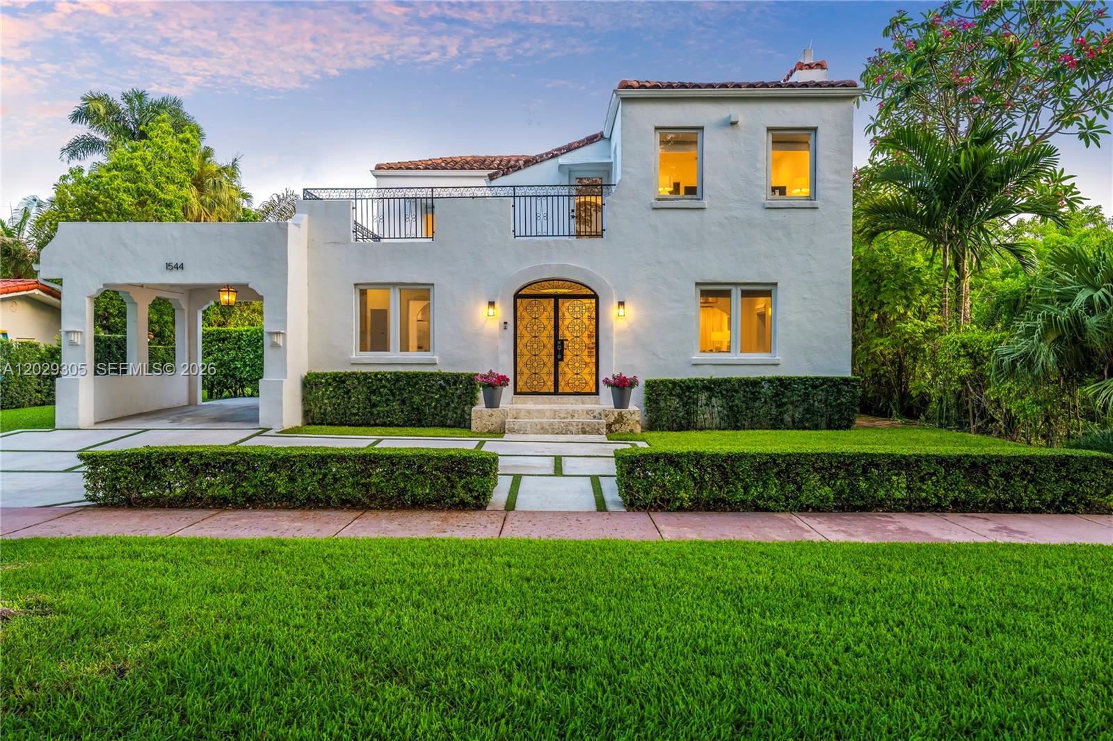 Built in 1926 and completely renovated in 2025, this exceptional Old Spanish residence with 2,833 Adj SF blends timeless Coral Gables charm with the finest modern design and craftsmanship. Sitting on an 8,250 SF lot and ideally located on a private, closed-off street, the home offers 3 bedrooms and 2.5 bathrooms in the main residence, and a 1-bed, 1-bath guesthouse poolside - all thoughtfully reimagined with high-end finishes.
The light-filled floor plan features elegant living and dining rooms that flow seamlessly to the covered terrace, pool, and outdoor entertaining areas. A stunning custom kitchen serves as the centerpiece of the home, showcasing an oversized island, bespoke cabinetry and Wolf appliances. A family room and artfully designed mudroom round out the downstairs space. Upstairs is a primary suite with a beautifully appointed bathroom and walk-in closet, and 2 more bedrooms and full bath.  Additional highlights include refinished hardwood floors, new impact windows and doors, and a large open upstairs porch. Complete with a covered carport, new concrete driveway and beautiful lawn, this move-in-ready property offers the rare opportunity to enjoy the character of a historic Coral Gables home with the comfort and sophistication of a complete 2025 renovation. Nothing has been overlooked.
