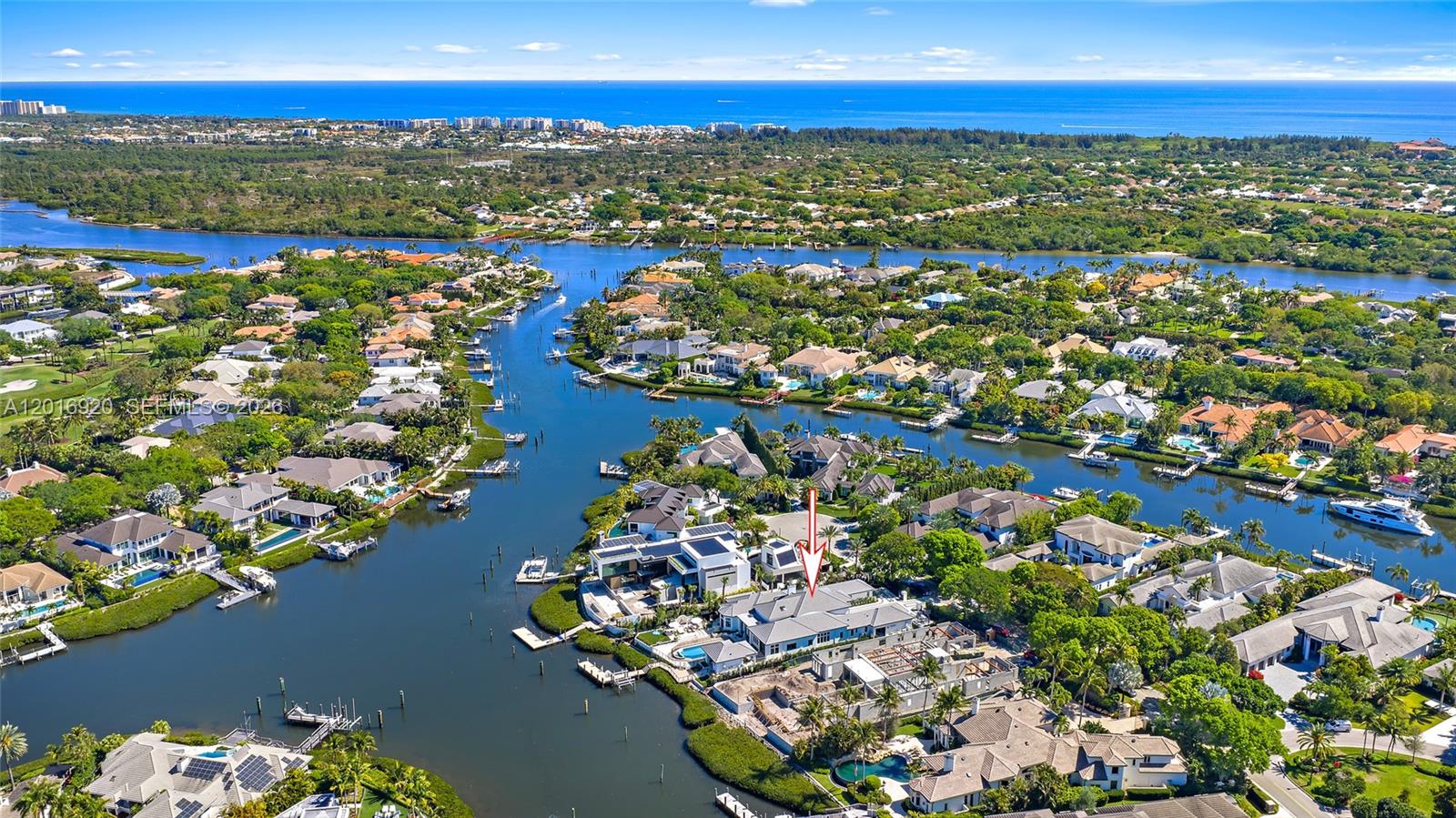 Located on a premier waterfront lot at the end of a cul-de-sac in Admirals Cove, 386 Eagle Drive sits on over half an acre—larger than most waterfront properties in the community—and has been extensively updated and thoughtfully redesigned with high-end finishes throughout. The home features a long canal view looking down the waterway, enhancing both the setting and privacy. The kitchen is designed for both everyday living and entertaining, featuring dual oversized islands with Cristallo countertops, a 60-inch Wolf range, Sub-Zero refrigeration, and custom Downsview cabinetry. The space opens to the main living areas and connects easily to the covered outdoor spaces, creating a functional indoor-outdoor flow.