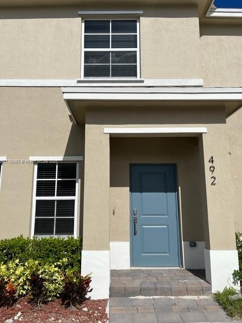 Beautiful Townhouse 2/2.5 with 2 assign parking spaces in front. Two bedrooms upstairs with its own private bathroom and walk in closet. Modern kitchen with s/s appliances. Washer & dryer. Patio. Gorgeous clubhouse pool, and fitness center. All information is approximate and not warranted or guaranteed. ONLY 1st MONTH RENTAL AND 1 MONTH SECURITY DEPOSIT!!