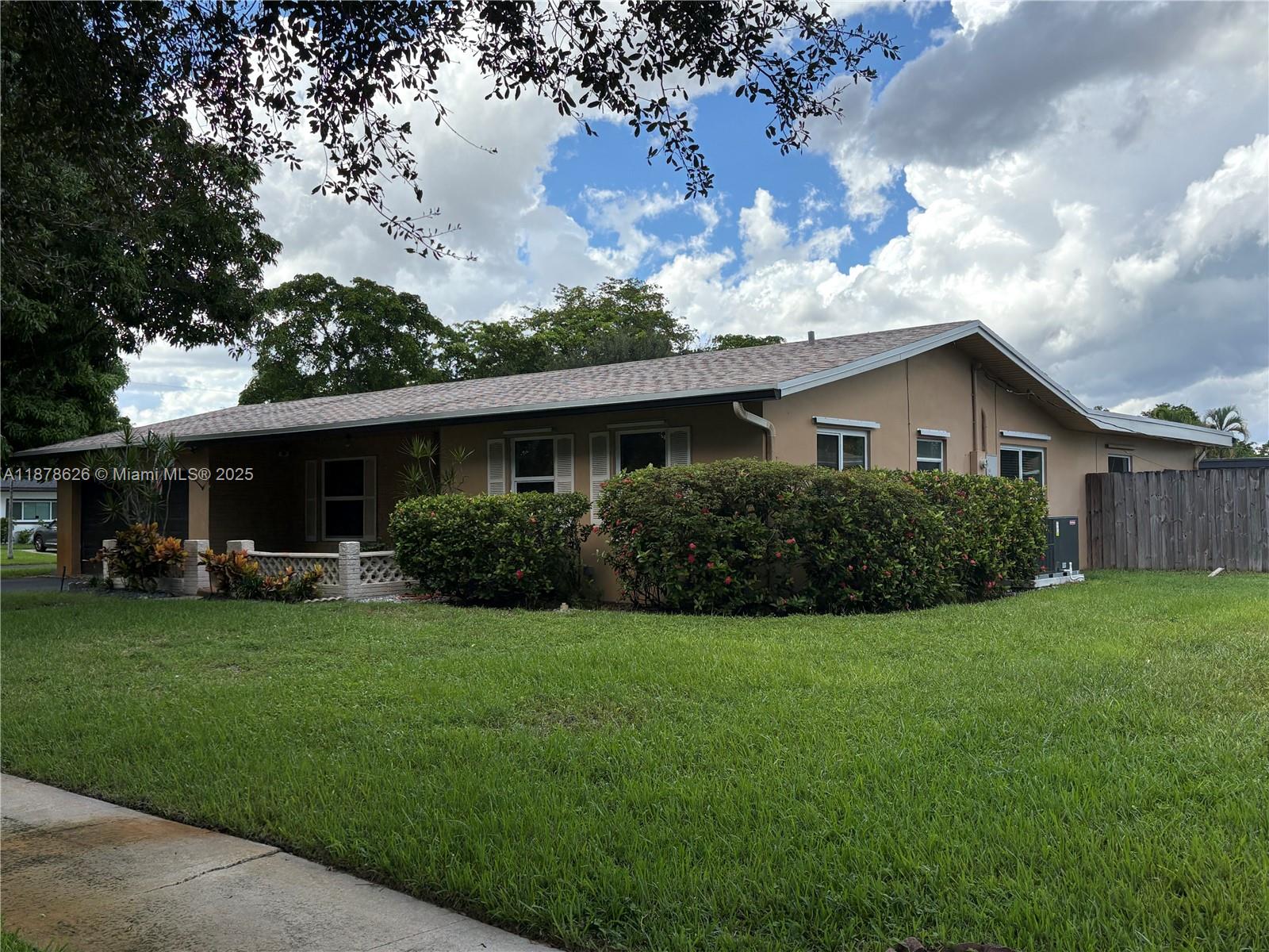 Look no further! The family home you have been looking for is this one. Sitting on an oversized corner lot, this home features 3 bedrooms and 2 bath with over 1800 sqft of living area.  Feel secure knowing the property has a new roof (2024), new AC (2025), and hurricane impact windows and doors all throughout the home.  If your looking for space; you got it here with over 10K sqft of property and a backyard that includes a pool.  Enjoy entertaining with a large backyard that can store an RV or boat if needed.  Fruit trees all around the property give you seasons of fresh fruit.  Including a Lychee tree in your front yard.  Come view this property as it will be highly sought out.