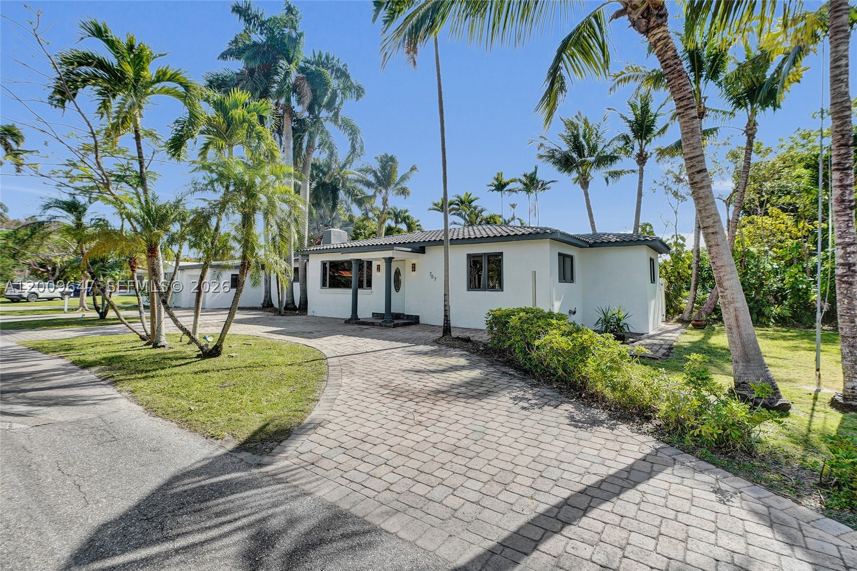 Bring your toys to this spacious corner lot in sought-after Hollywood Lakes! This 3-bed, 3-bath gem boasts a massive driveway for 8 cars, a garage, and side yards with room for your boat, RV, plus impact windows and doors throughout most of the home, and updated baths. Step outside to your private, fully fenced yard with lush coconut trees, an outdoor kitchen, and a perfect space for entertaining. Walk to Hollywood Beach, Downtown, parks, lakes, and the golf course. Ideal for personal use or as a licensed Airbnb with proven income potential. A true South Florida paradise! Agents please use show asset for showings & availability.