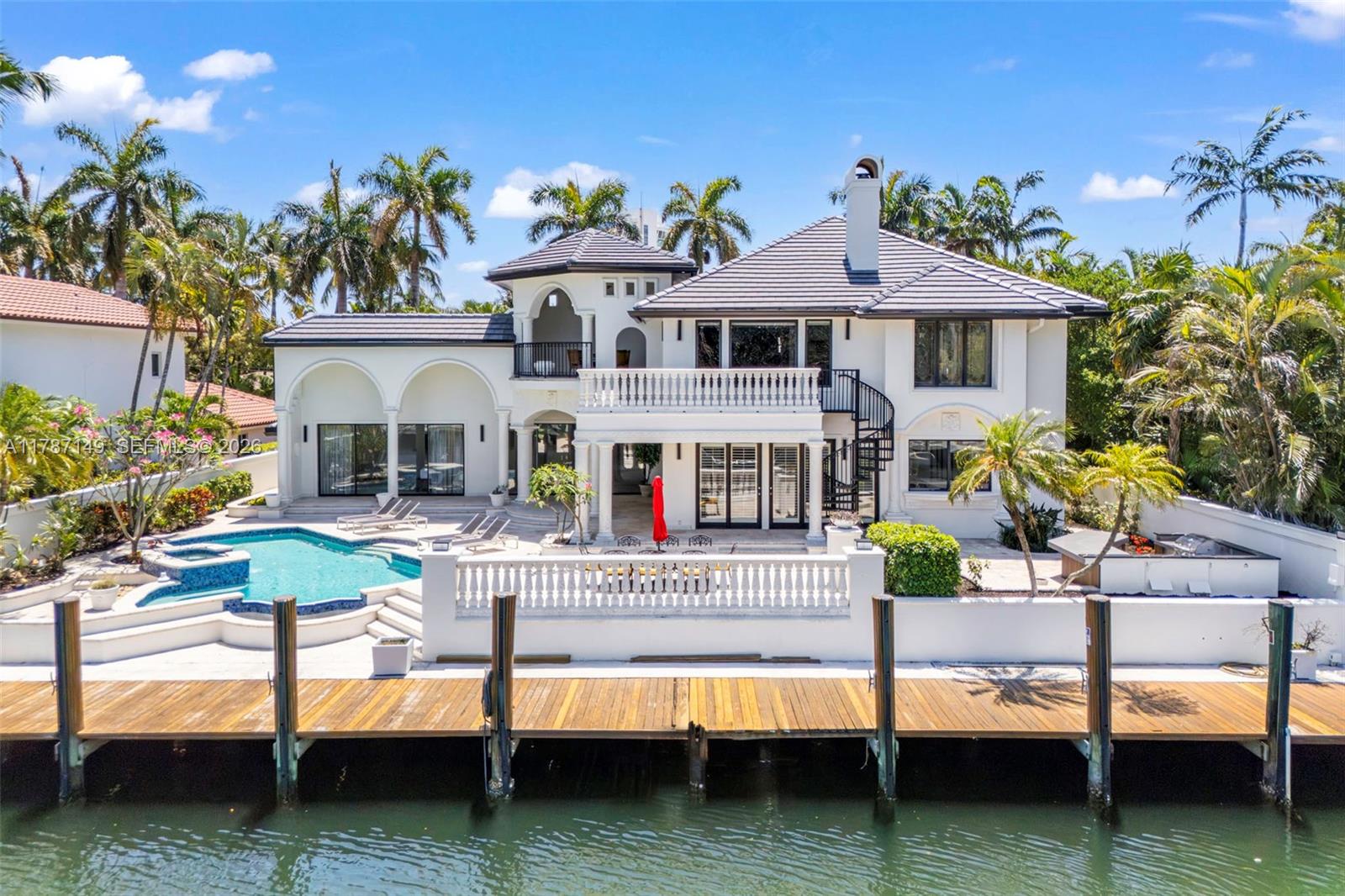 Transitional-style home with modern upgrades .  Highly sought-after community of Harbor Beach. Impressive remodel of  5-Bedroom,4.5-bath.  New roof, 5,300SF of flowing living area and spacious layout. Owner's suite includes large soaking tub, shower, sauna creating a spa-like experience. Storage is never an issue...large walk-in closets. Modern kitchen, a chef's delight. Top of the line appliances. Beautifully landscaped private retreat. Backyard features a pool and outdoor kitchen. Enjoy serene water views from your balcony or poolside. 95' dock for a 75' yacht. Deep water-ways and quick ocean access. Harbor Beach offers gated and guarded security. Walk to private beach and new Pier 66 Resort with its world class restaurants.