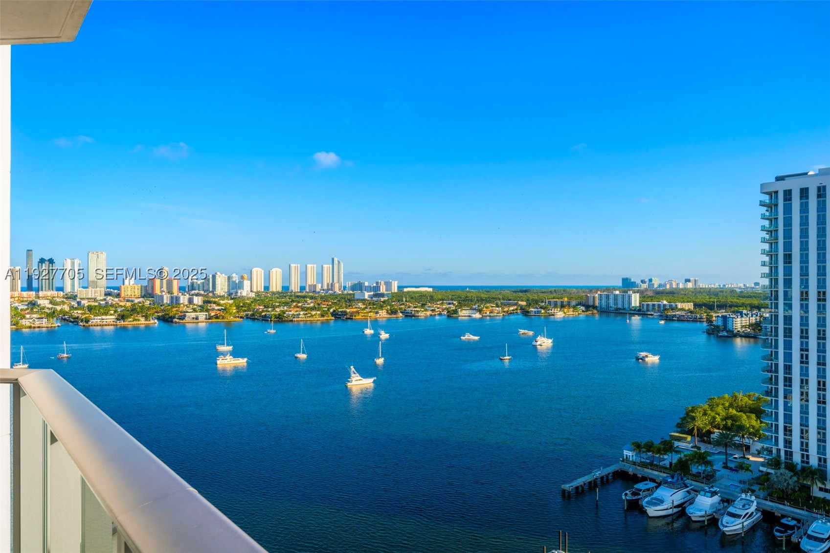 Set above the marina with wide, unobstructed Intracoastal and ocean views, this 1,670 SF residence offers a calm, refined take on waterfront living in Aventura. Originally delivered as a developer model unit, Residence 1803 features upgraded finishes and a thoughtful coastal design framed by floor-to-ceiling windows and a private terrace overlooking the water.

The split-bedroom layout enhances privacy while inviting natural light throughout the home. Interior details include electric blinds, blackout shades, drop-down ceilings with recessed lighting, custom millwork, custom doors and door frames, and a contemporary open kitchen appointed with integrated appliances and stone countertops. The primary suite serves as a peaceful retreat with a custom walk-in closet and a spa-inspired bath finished in glass and stone—all oriented toward wide water views.

Practical benefits add meaningful value: two deeded parking spaces, with the option to sell one separately (valued around $60,000), and no current assessments.

Residents enjoy access to a full-service marina and yacht club, resort-style amenities including a waterfront pool deck, fitness center, spa, children’s playroom, concierge, valet, and 24-hour security. Ideally located within the Aventura marina district, close to beaches, dining, SoLé Mia Hospital, and shopping—with Houston’s next door—Residence 1803 blends modern coastal design with the comfort and convenience of luxury waterfront living.