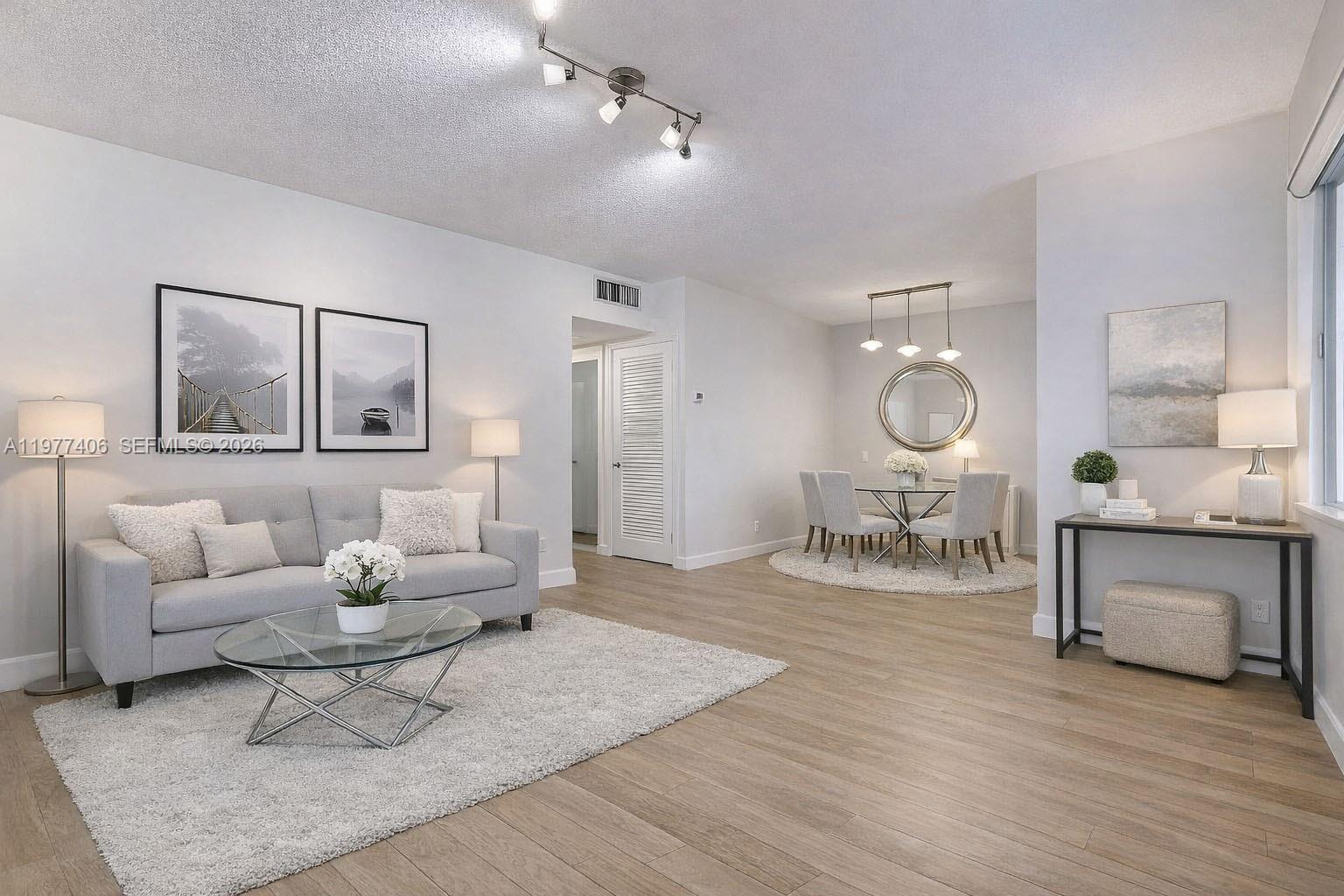 Premier 55+ community at Beverly Hills Condo in Hollywood, centrally located on the top floor - this 2 bedroom, 1.5 bath condo features comfortably sized bedrooms, white spacious kitchen cabinetry, hurricane impact windows throughout, tankless water heater, spacious entrance and screened balcony.  Light and bright with great natural sunlight.  Enjoy resort style amenities including pool, clubhouse, library, billiards/game room.  Association requires 1 year's worth of maintenance to be held in escrow after closing.  No rentals permitted the first year of ownership.