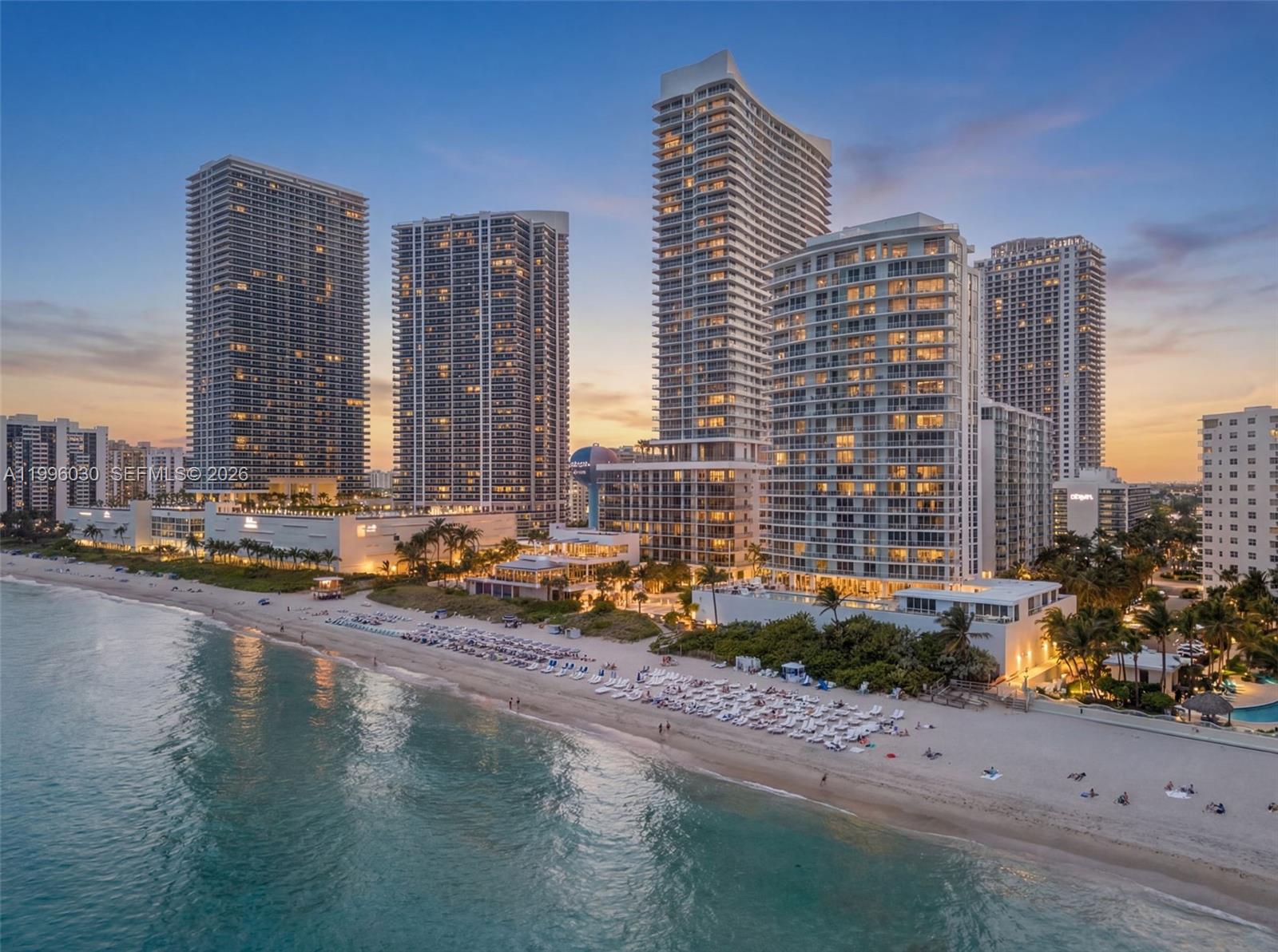 Exceptional 4-bedroom, 5-bathroom + den oceanfront residence offering a true front-row seat to the Atlantic, with breathtaking, unobstructed views of both the ocean and Intracoastal. From spectacular sunrises over the water to glowing city sunsets, every space is thoughtfully designed to impress. Floor-to-ceiling impact glass and a flow-through layout flood the interiors with natural light, while the expansive terrace provides the perfect setting for seamless indoor-outdoor living, entertaining, or quiet relaxation above the coastline. Featuring a gourmet chef’s kitchen with premium appliances, custom cabinetry, and refined finishes that flow effortlessly into spacious living and dining areas. Generously sized bedrooms with en-suite baths ensure privacy and comfort, highlighted by a luxurious primary suite with a spa-inspired bathroom and captivating water views.
Located at Apogee Beach Hollywood, a boutique building with only 64 units, residents enjoy an exclusive lifestyle complemented by resort-style amenities including beachfront service, infinity-edge pool, state-of-the-art fitness center, sauna, valet, and 24-hour concierge.
Perfectly positioned just minutes from Aventura Mall, Bal Harbour Shops, world-class dining, and Fort Lauderdale-Hollywood International Airport, this is a rare opportunity to secure a premier oceanfront residence in one of Hollywood’s most exclusive addresses.