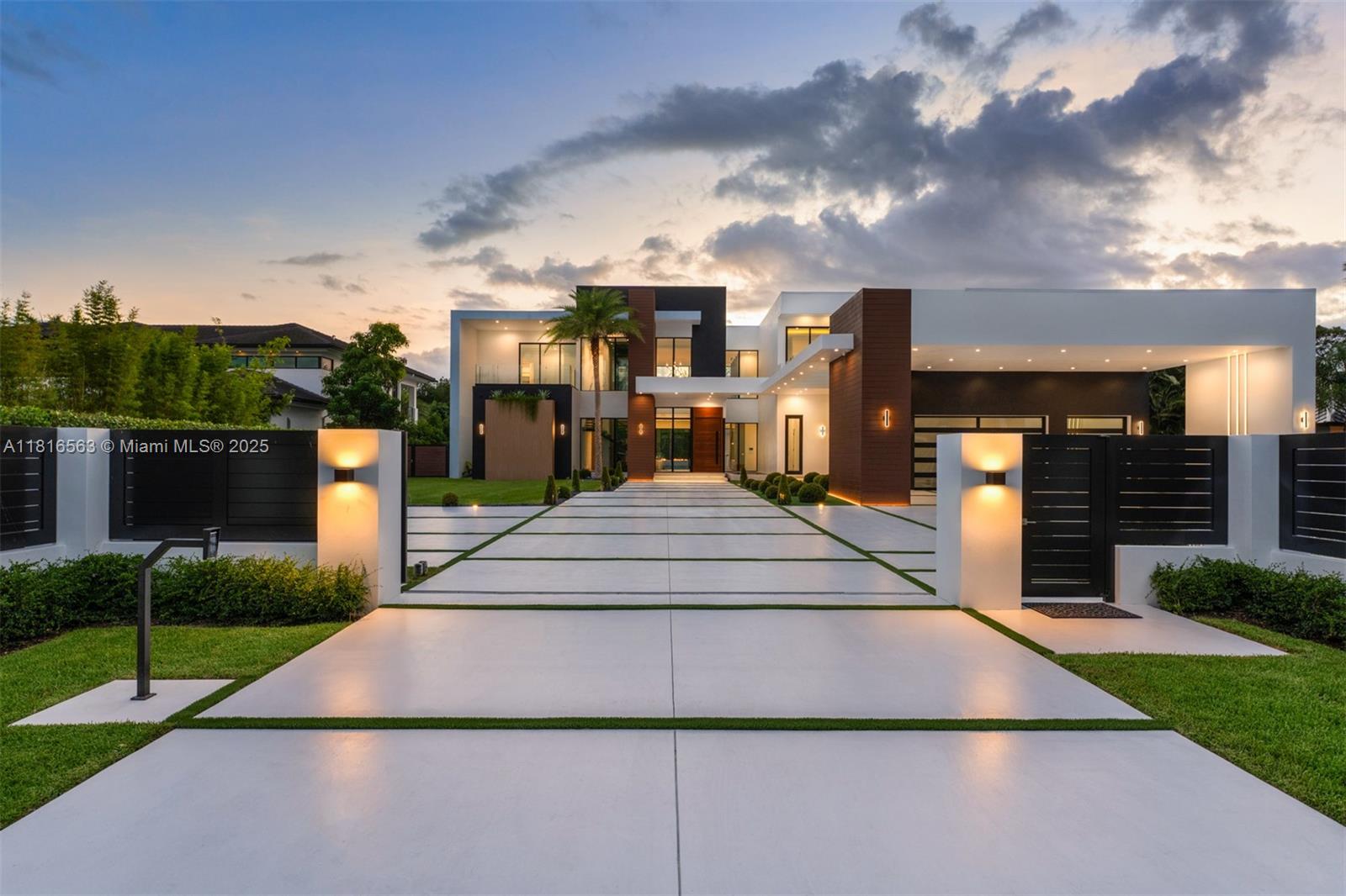 Experience refined modern luxury in this 6-bedroom, 7.5-bath masterpiece spanning 9,616 SF. The home features a state-of-the-art home/theater, a private office, and a sauna. The chef's kitchen boasts Miele appliances, slab porcelain countertops with Italian style cabinetry. Enjoy the integrated sound system, a striking Italian oak wood staircase, and a wine gallery. Outdoors, a 53x17 heated pool and Jacuzzi, massive fire pit, and expansive covered areas create an entertainer's paradise with a full summer kitchen. Equipped with an elevator, epoxy 3-car garage plus 3-car carport, and full smart home automation with 28 security cameras and space for a Tennis or sports court, close to major schools and highways.