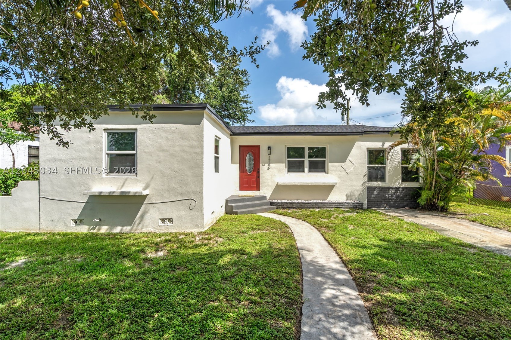 Fully renovated and move-in ready! This beautifully updated home features a newer roof, impact windows and doors, new flooring, LED lighting, and a fully renovated kitchen with quartz countertops, modern cabinetry, and brand-new stainless steel appliances. Both bathrooms have been tastefully remodeled with contemporary finishes. The spacious primary suite offers comfort and privacy, while the bright, functional layout is perfect for everyday living and entertaining. Step outside to a newly built deck overlooking a large backyard with plenty of room to add a pool, expand your outdoor living space, or create your dream backyard. Conveniently located near major highways, shopping, dining, schools, and parks. A turnkey home offering style, quality, and value. Schedule your private showing today!