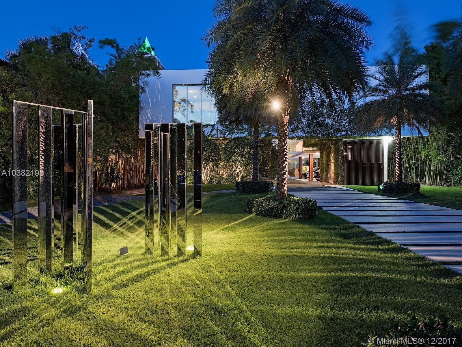 Ultra-chic residence, inspired by Le Corbusier designed for the most discerning buyer. One of the only estates on Pine Tree drive with direct ocean views, sitting on an acre of land on the wide portion of the intercostal. Designed by world-renowned architect Kobi Karp, this home is set back from the street by a long deep driveway. Spiral staircase modeled after the Guggenheim Museum leads to rooftop terrace with 360-degree views of Miami's skyline. Chef's kitchen, fully equipped 10 seat home theater and separate state of the art fitness center. Patio area with seamless edge heated salt water pool with integrated spa and summer kitchen. Separate guest house and a half basketball court overlooking the water. Centrally located, minutes from the beach,restaurants, hotels and clubs.