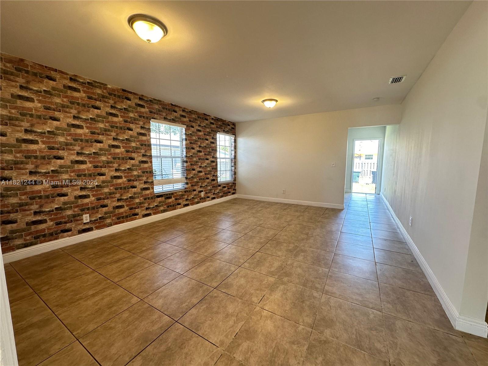 This charming single-family home is located in the heart of Hollywood. This property features three bedrooms, two bathrooms, wood cabinets, a tile floor, central A/C, freshly painted walls, and a washer and dryer hookup—a fenced backyard with an alley street and a carport garage. Enjoy the Florida lifestyle in this cozy and well-maintained home. Take advantage of this opportunity! If a pet is approved, a non-refundable deposit of $300 will be required. Dogs can weigh up to 20 pounds; landlords don’t accept dogs over that weight. Before moving in, the landlord requires mandatory renter insurance, the first month, and two security deposits.