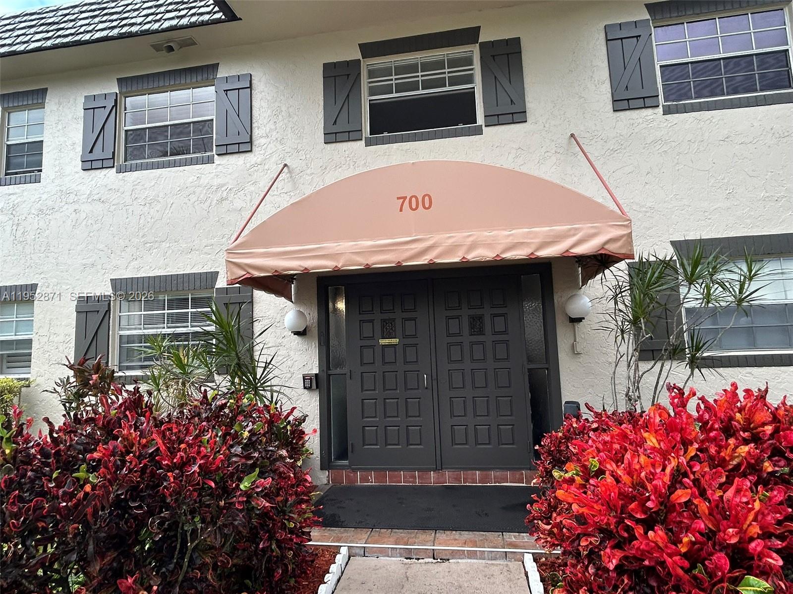 Reduced! Spacious sunny 1Bed/1bath unit, fully remodeled - This turn key fully equipped condo has everything you need with modern new furniture and accessories. The kitchen was nicely redone with  new cabinets, new appliances and lots of storage. The bathroom was also nicely redone. All tile floors, new electrical panel, recently painted, new AC 2022. Spacious bedroom with large walk-in closet and storage. Beautiful modern and luxury furniture. The screened patio offers a view to the garden and a storage closet. Very well maintained complex with heated pool, shuffleboard, bocce/petanque, Tennis and pickle ball courts, BBQ area, bike storage area, Club House with card and billiard rooms. Active 55+ community with social program during the winter months. Complex went through 50 year certification. The property can be seasonally rented for 3-6 months once a year. Condo is a few steps from the pool and Clubhouse, near shopping and grocery stores, near major highways and a few miles from the airport and the Beach. It offers reasonable condo fees  which includes water, sewer, garbage, laundry room and other services ($412/month). If you are planning to stay for a few month or year-round, this apartment is ideally located near all services and offers a great peaceful surroundings with lush vegetation and gardens while being in an active community. No assessments are due.