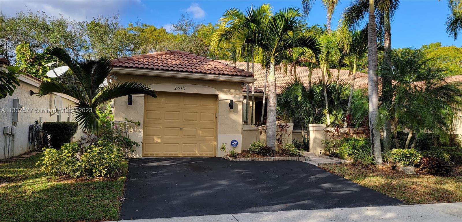 The ultimate in carefree living, inside a cozy and quiet neighborhood. This gated community enjoys a beautiful state of the art swim club, includes a heated athletic pool, family pool, kids interactive pool, jacuzzi, miniature golf, picnic/grilling area, party rooms and even a restaurant. Original Owner! Association maintained.
Enjoy this secluded and private location in a relaxing patio with lots of room to roam. Lots of money spent in front landscaping and beautiful lighting with pavers in entrance walkway.  2 bedroom home, 2 bath, inviting kitchen with a convenient kitchen island. You will love the hardwood flooring throughout except the secondary bedroom. Worry free accordion shutters in every window. Brand new Air conditioning, 1 year old. High-hat lighting in main areas.