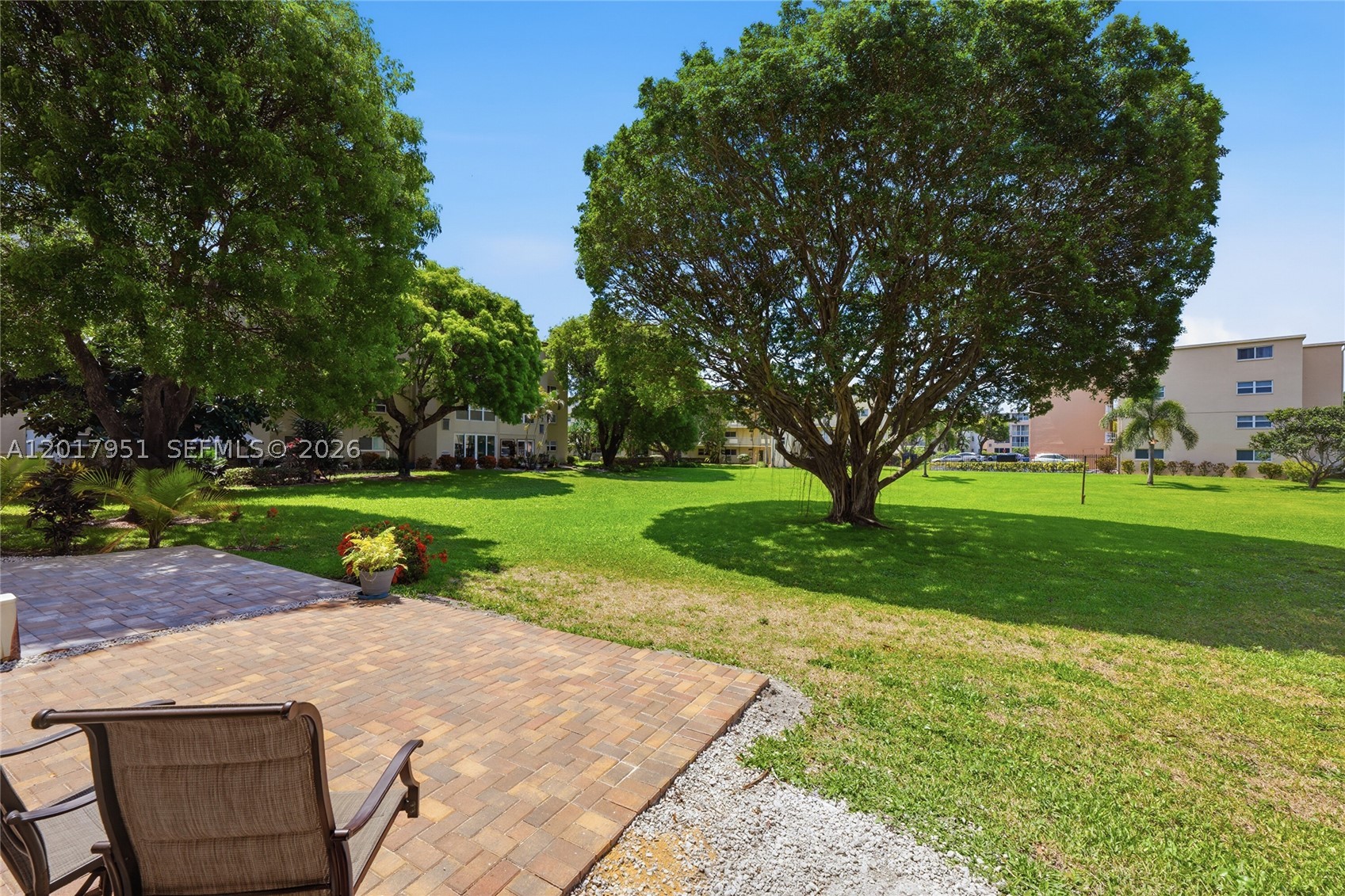 Move right into this beautifully updated 2BR/2BA first-floor condo located in a 55+ community. Renovated from the studs, this home features hurricane impact windows and sliders, a new electrical panel, wood flooring throughout, quartz countertops, stainless steel appliances, and stylish modern finishes.

A true highlight is the oversized extended patio, providing additional outdoor living space to relax, entertain, enjoy your morning coffee, or simply take in the peaceful green space and mature trees.

Additional conveniences include an in-unit washer and dryer, assigned parking just outside your door, and access to outstanding community amenities, including two pools, a fitness center, pickleball and tennis courts, and more.

With virtually everything updated, this move-in-ready home offers comfort, convenience, and peace of mind from day one.
