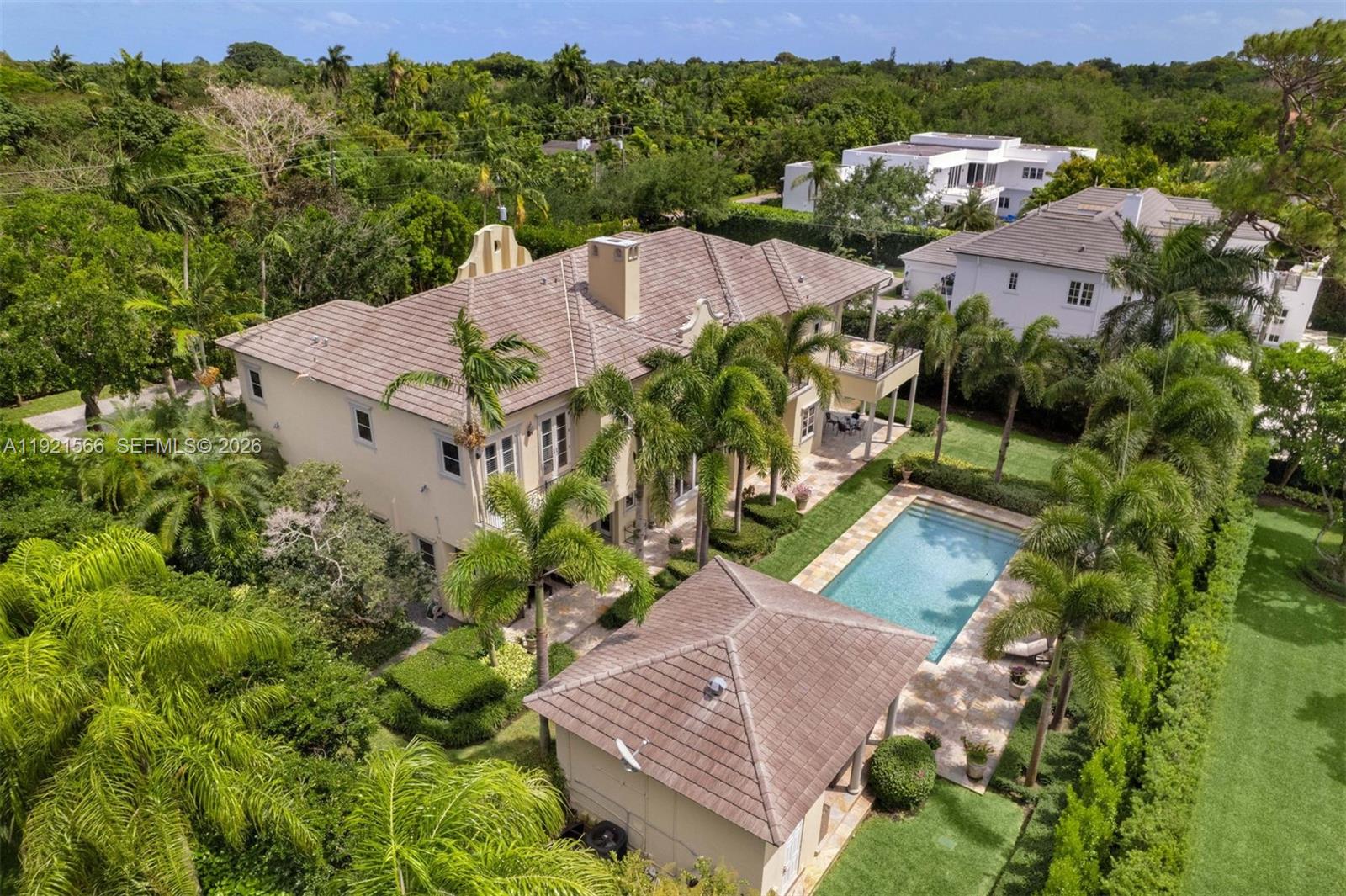 This chateau-inspired 9,289 SF, 7-BD, 8-BA gated residence boasts a meticulously designed layout on an
expansive 29,292 SF lot. Upon entry, the stunning grand foyer offers voluminous ceilings, complemented by an
exquisite marble staircase. A true chef’s kitchen features an expansive island, marble countertops, custom
cabinetry, premium appliances and a gas range, built-in coffee-espresso machine, and water filtration system.
Outdoor spaces include covered terraces, a fully equipped summer kitchen, heated pool with jacuzzi, and lush
landscaping and hedges that offer complete privacy. Additional features include impact windows and doors, wine
cellar, media room, whole-house generator, smart home with integrated lighting, audio, and security systems, a 3-car garage, and a brand new roof.