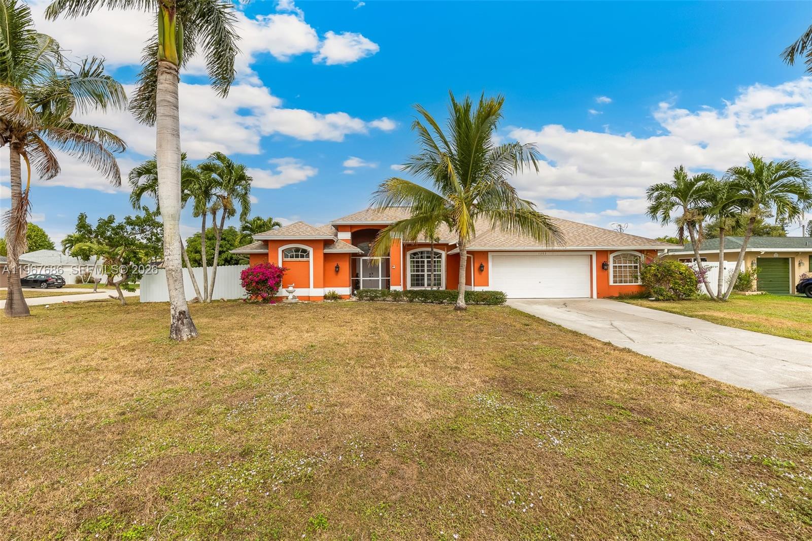 Drop Price! Experience living in this stunning, corner-lot home in Cape Coral. Offering over 2,200 sqft. beautifully designed space, this residence features a sparkling private pool, well located close to Veteran's bridge and close to restaurant, shopping and much more. No flood zone or HOA. Assumable Mortgage Loan option with 2.75% interest.  *Bring your offer, Seller motivated and Seller Contribution base on offer*