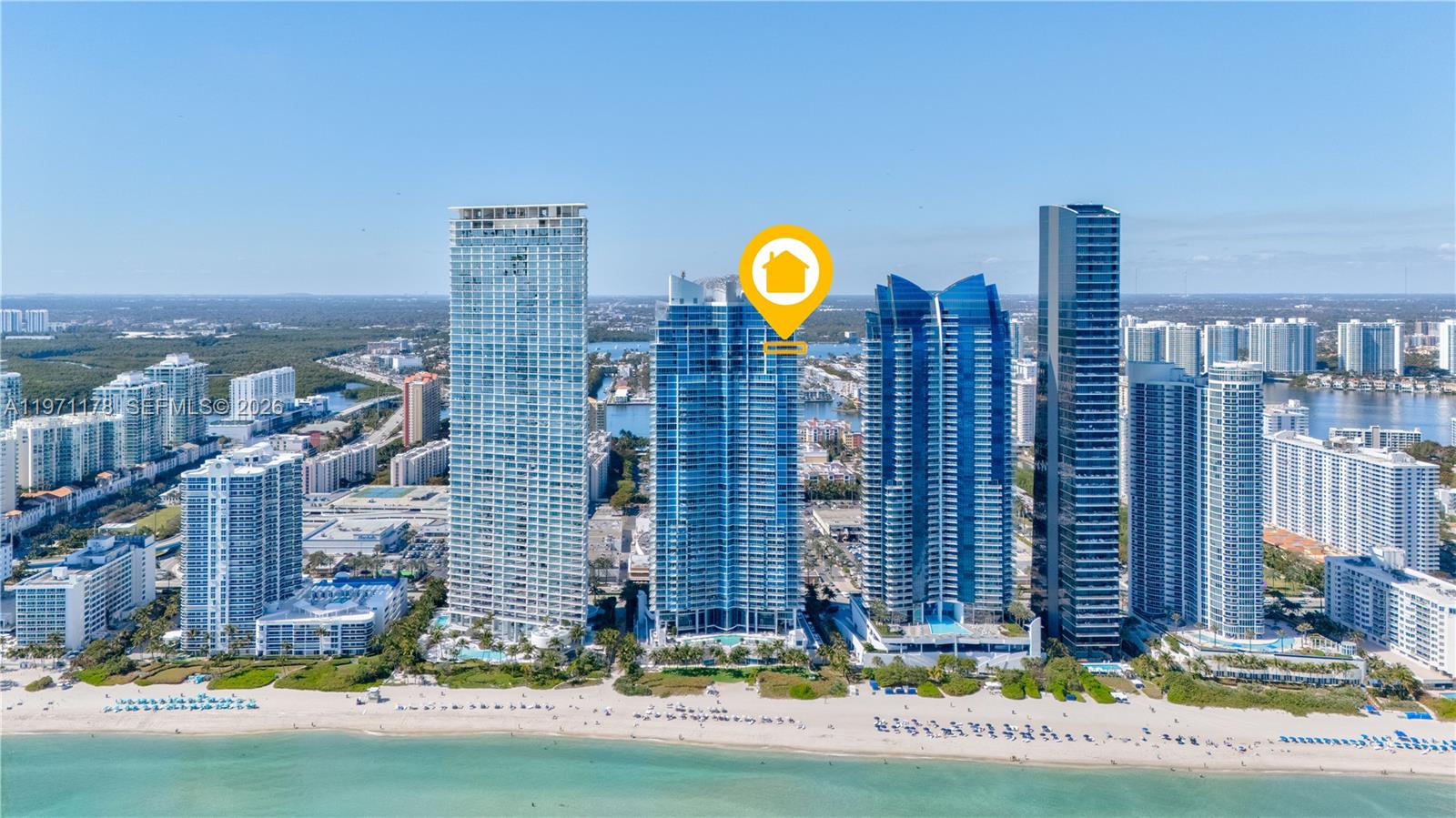 Unique opportunity to own the largest single-level 4-bedroom, 5.5-bath corner residence at Jade Beach. Line F is the biggest four-bedroom floor plan in the building and is very hard to find on the market. This special layout offers an oversized living room with floor-to-ceiling glass and expansive terraces showcasing breathtaking direct ocean, Intracoastal, and city views with both sunrise and sunset exposures. The flow-through design provides exceptional natural light, privacy, and space, making it ideal for full-time living or entertaining. The modern kitchen features premium Miele appliances, Sub-Zero refrigerator, built-in coffee system, and wine cooler. Generous bedroom suites and ample closet space complete this exceptional residence.
Jade Beach delivers a full luxury lifestyle with oceanfront pools, beach service, spa, fitness center, concierge, and more, centrally located in Sunny Isles Beach just minutes from Bal Harbour Shops and Aventura Mall.