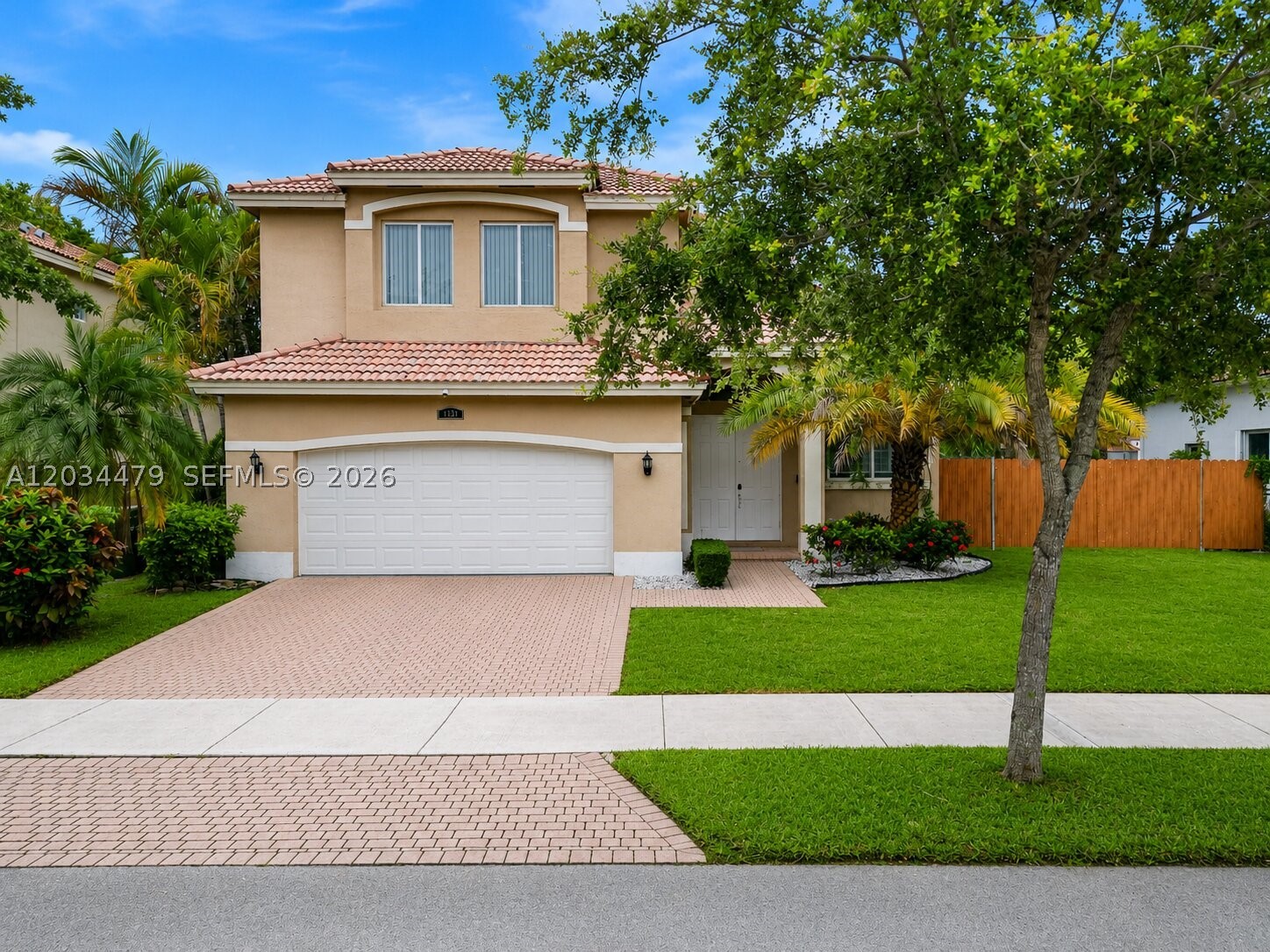 Discover the perfect blend of space, comfort, and waterfront living in this charming 2-story home nestled within the gated community of Keys Landing. Boasting tranquil lake views, large lot with space for boat, 4 bedrooms, 2.5 bathrooms, and a 2-car garage, this well-maintained residence offers plenty of room to grow while presenting an excellent opportunity to add your own modern touches and create your dream home. Inside, you'll find an open and functional floor plan with hardwood floors, soaring ceilings, walk-in closets, and a bright Florida room that provides additional living space and plenty of natural light. The home has been well maintained and offers an excellent opportunity for a buyer to add their personal touch and modern updates over time while enjoying immediate comfort and livability. Step outside to your private backyard retreat overlooking the lake, complete with a patio and jacuzzi—perfect for relaxing evenings, entertaining guests, or enjoying peaceful water views. Enjoy the security and privacy of this gated community.. Conveniently located near shopping, dining, schools, and the Florida Turnpike, this property combines space, location, and waterfront living at an exceptional value. HOA includes cable and high-speed internet. Conveniently close to shopping, dining, and the Florida Turnpike. No HOA Approval required! Don't miss this opportunity to make this charming lakefront home your own! Priced to Sell!