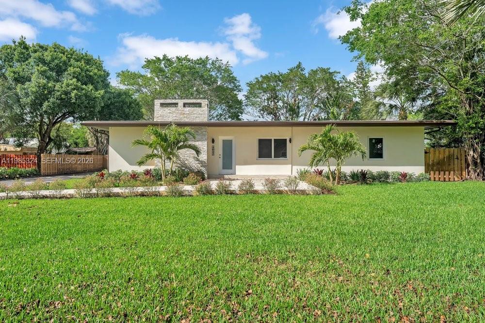Completely renovated 4-bedroom, 2-bathroom home on a half-acre lot in the highly desirable Country Club Estates. This turnkey property has been upgraded from top to bottom with high-end finishes, featuring a custom luxury kitchen by Poggenpohl with premium craftsmanship and modern design, along with fully updated bathrooms and impact windows throughout for security and efficiency. The spacious, open layout offers abundant natural light and seamless indoor-outdoor living. Step outside to a large private backyard with a pool and plenty of space for entertaining or future expansion. Located in a quiet, well-maintained community adjacent to the golf course, offering privacy and a premium setting. Conveniently located near major highways, shopping, dining, and just minutes to Fort Lauderdale in a safe, established neighborhood.