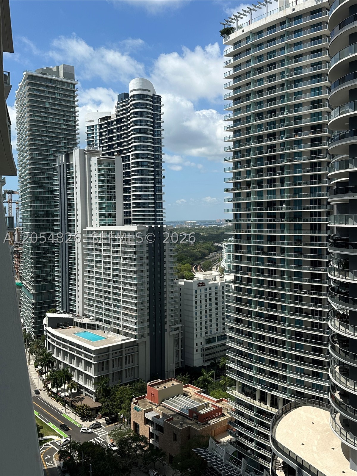 Brickell Resort-Style. this 2-bedroom, 2-bath residence facing south at 27th floor featuring a modern open layout, floor-to-ceiling windows, tile flooring throughout, and a spacious private balcony with stunning city views, the unit includes top line appliances, located just steps from Mary Brickell Village, Brickell City Centre, top-rated restaurants, cafés, nightlife, shopping, and Miami's financial district. Residents of 1010 Brickell enjoy resort-style amenities including a state-of-the-art fitness center, indoor heated pool, rooftop pool with breathtaking views, spa, sauna and steam rooms, indoor basketball and squash courts, bowling alley, virtual golf simulator, movie theater, outdoor running track, BBQ area, children's playroom, social lounge, Packages Mail receive station, and 24-hour concierge and security, security at lobby, Valet parking service.