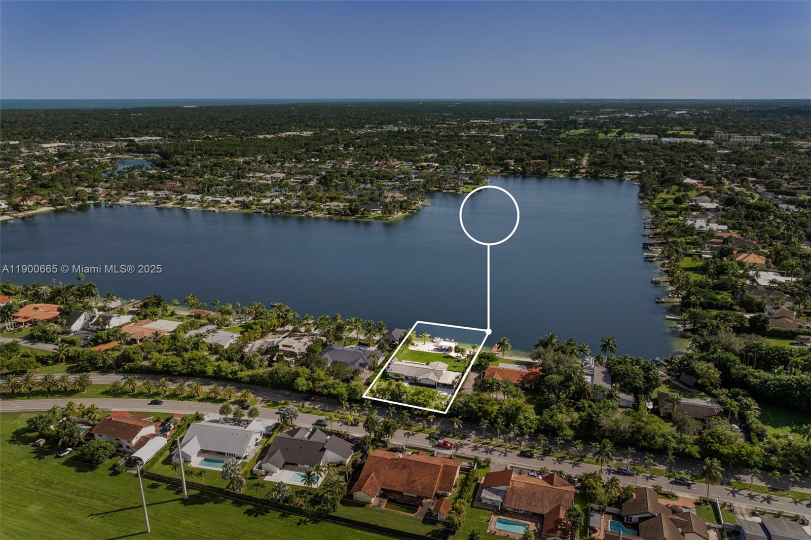 This isn’t just a home; it’s a private lakeside sanctuary on one of Miami’s only operable lakes, where jet skiing, boating, kayaking, sailing, and water skiing become part of your everyday lifestyle. Set on an impressive 22,900 sq ft, remodeled 4-bed, 3-bath residence captures the essence of South Florida luxury living. Open living spaces, abundant natural light, and spectacular wide-lake views from sunrise through the afternoon. Step outside to your own private paradise, complete with a sparkling pool, lush green lawn, and a private sandy beach leading to the crystal-clear waters of E-Lake. The outdoor kitchen and covered lounge area are perfect for entertaining, while the expansive dock with boat and jet ski lifts provides easy access for water sports and lakefront enjoyment.