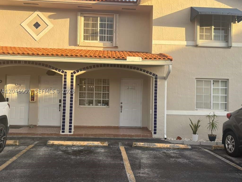 Excellent opportunity to own a well-appointed 2BD/2BA condo in the heart of Hialeah Gardens. This 870 SF unit features an open-concept kitchen flowing into a generous living area, a primary suite with private full bath, and in-unit washer/dryer. Hurricane roller shutters on every window provide quick, easy storm protection. Two assigned parking spaces directly in front of the unit plus ample guest parking. Prime location with immediate access to the Palmetto Expressway and Florida Turnpike — minutes to BJ's, Walmart, and major retail corridors. Top-rated schools nearby. Ideal for first-time buyers or investors.