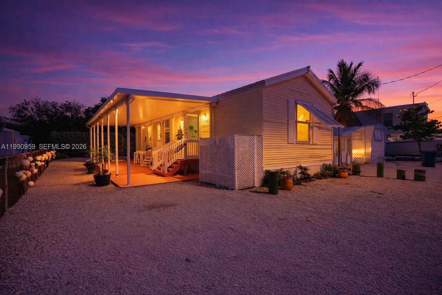 Excellent opportunity to own a piece of the Key Largo lifestyle! This charming 2-bedroom, 1-bath home offers endless potential as a full-time residence, vacation getaway, seasonal retreat, or income-producing property.

Unlike many manufactured homes in the Florida Keys, THIS PROPERTY INCLUDES THE LAND — no land lease and no monthly land rental fees. Own both the home and the oversized lot fee simple.

The home features an open layout, updated kitchen with stainless steel appliances, and a large covered porch perfect for relaxing or entertaining outdoors. The spacious lot provides ample parking for vehicles, boats, trailers, or future customization to create your own tropical oasis.

Located in a community with access to a private boat ramp and waterfront lounging area, this property offers the boating and water lifestyle buyers dream about — without premium waterfront pricing. Conveniently positioned near local restaurants, marinas, shopping, and recreational attractions.

Whether you are looking for an affordable entry into Key Largo homeownership, a weekend escape, or an investment opportunity in one of the most desirable areas of the Florida Keys, this property checks all the boxes.

Low-maintenance, versatile, and full of potential — your Keys paradise awaits!