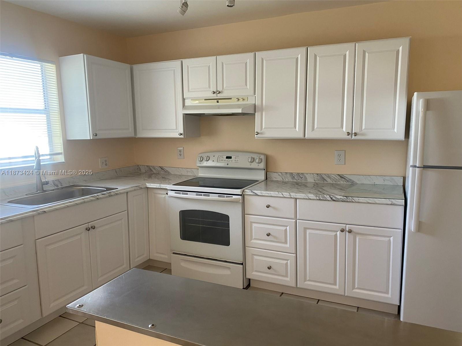 Best and largest line of the building! WATER VIEWS. Beautifully renovated condo in Coral Springs. Tiled throughout and freshly painted. Newer kitchen. 2 bedrooms/ 2 bathrooms. 1,080 sq ft. Unit is located on the third floor (accessible by elevator or stairs). Corner unit. Beautiful screened balcony with lake view. Laundry room on each floor. Many amenities available in this community, such as a pool and a children playground. Very quiet community. Water included in the fees. Assigned parking spot. Tenant occupied.