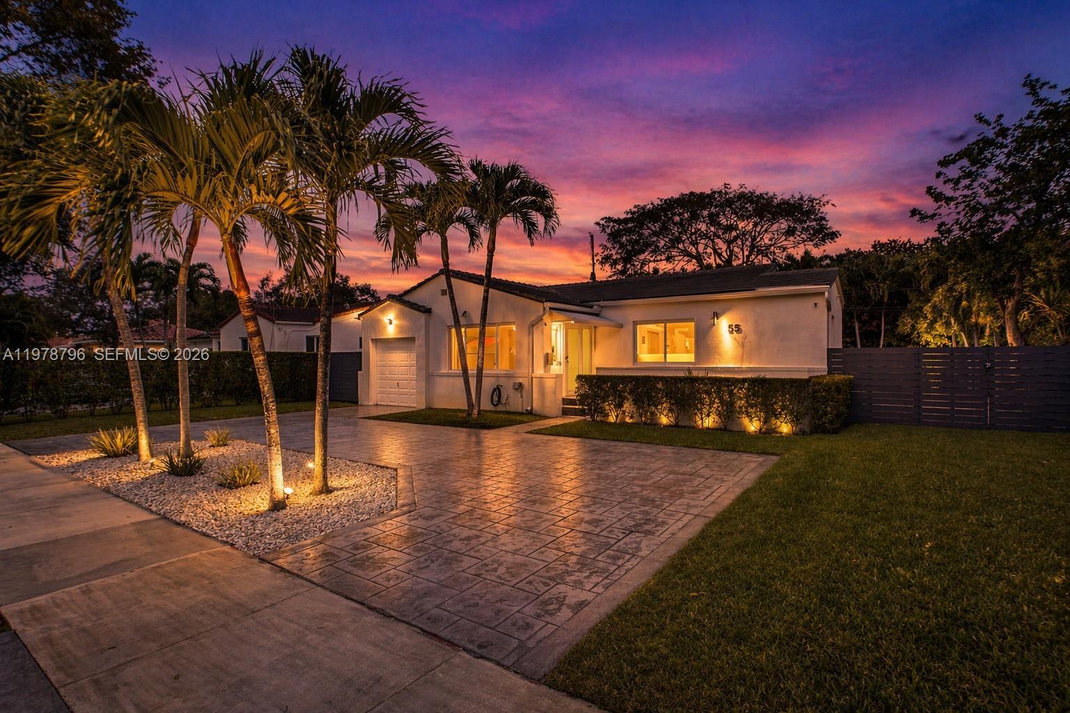 Nestled in the highly desirable Miami Shores, this updated 2 bedroom home sits on a tree-lined street and boasts a spacious lot with an inviting outdoor area, ideal for entertaining. Thoughtfully upgraded in 2020, the property features a new roof, electrical panel, hurricane impact windows and doors, irrigation system, and a circular driveway. The redesigned kitchen and fully renovated bathrooms reflect modern style and functionality. The flexible floorplan includes a versatile room currently used as a dining area, easily convertible into a third bedroom. The garage has been transformed into a climate-controlled gym with a brand-new split AC unit, offering additional lifestyle space. Every detail has been carefully considered for comfort, style, and modern living.