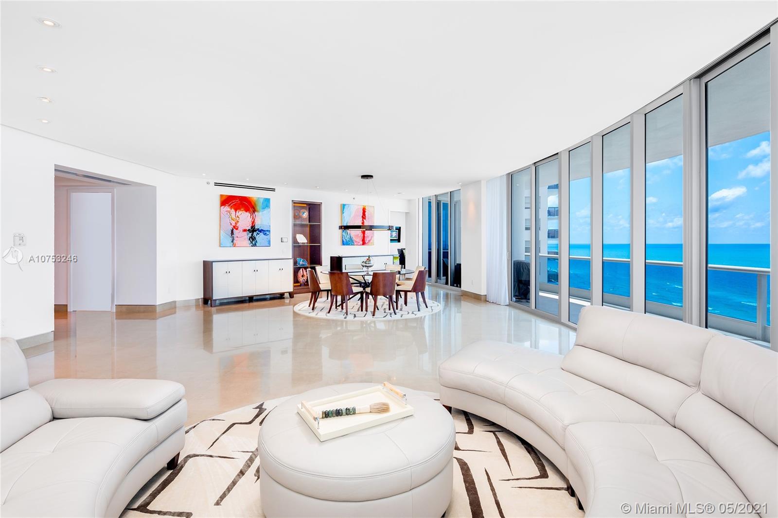Two units have been expertly combined & masterfully remodeled at the exclusive Bath Club. The sleek Northeast corner Smart home features 4BR+office/5+1BA (includes service quarters w/full bath), limestone & rich walnut wood floors, a flow-through open living & dining layout w/step out access to a large terrace & direct beach/ocean/sunrise views. An open gourmet kitchen sports top of the line appliances & breakfast area. The unit boasts 2 spacious principal suites – one w/ocean views & second w/bay & city views each w/amazing principal bathrooms. A spacious family/media room ideal to entertain w/stunning custom onyx wet bar & step-out access to a second terrace w/bay/city & sunset views. The 2 other bedrooms are each uniquely designed w/en-suite bathrooms. Enjoy 5-Star Bath Club amenities.