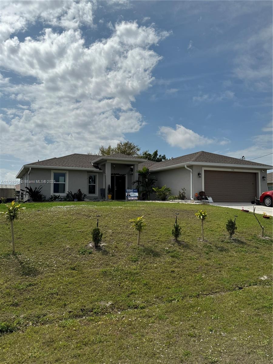 This home includes 4 bedrooms, 2 bathrooms, a 2car garage, an open kitchen, dining, and living area. Tiled throughout. The kitchen has plenty of cabinet space as well as an island and a pantry. The home features a screened lanai from the dining area. A laundry room with connects the home to the garage. (washer and dryer not included).  Backyard has plenty of room for a pool. Not located in a flood zone.